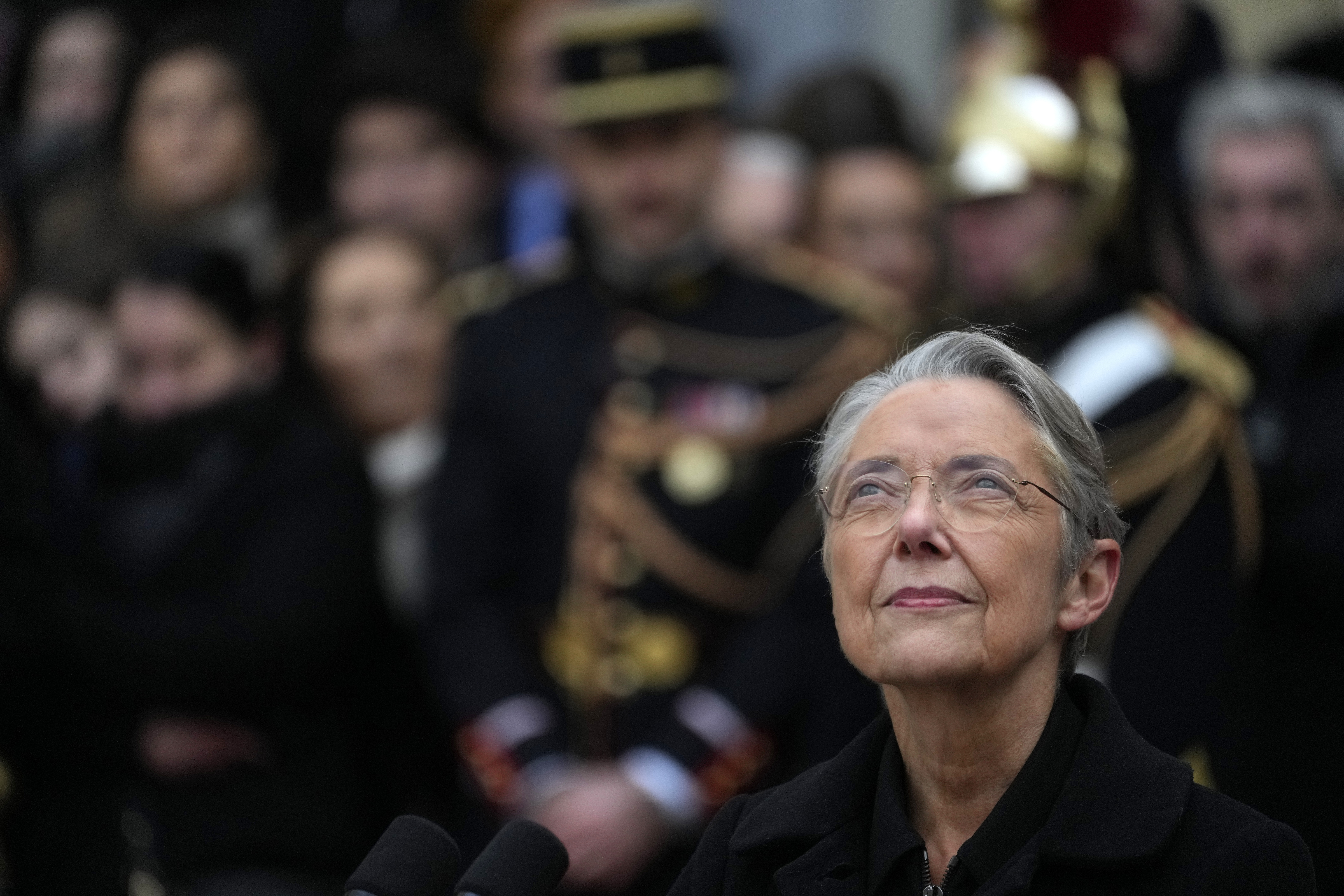 FILE - Outgoing French Prime Minister Elisabeth Borne looks up after the handover ceremony, Tuesday, Jan. 9, 2024 in Paris. (AP Photo/Thibault Camus, File)