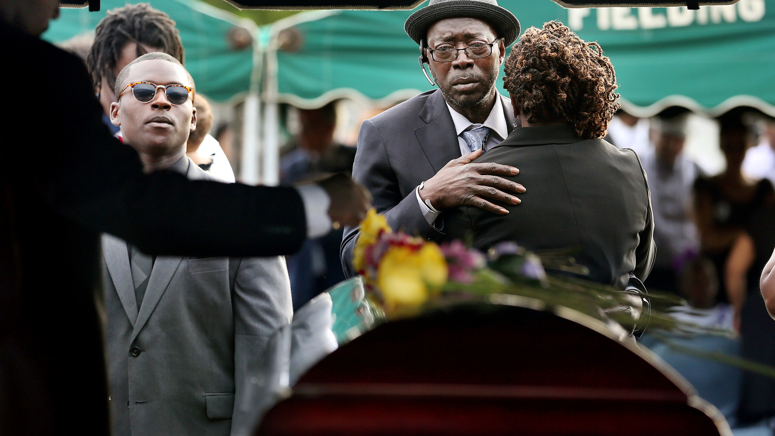 FILE - Tyrone Sanders and Felicia Sanders comfort each other at the graveside of their son, Tywanza Sanders, on June 27, 2015, at Emanuel AME Cemetery in Charleston, S.C. (Grace Beahm/The Post And Courier via AP, File)