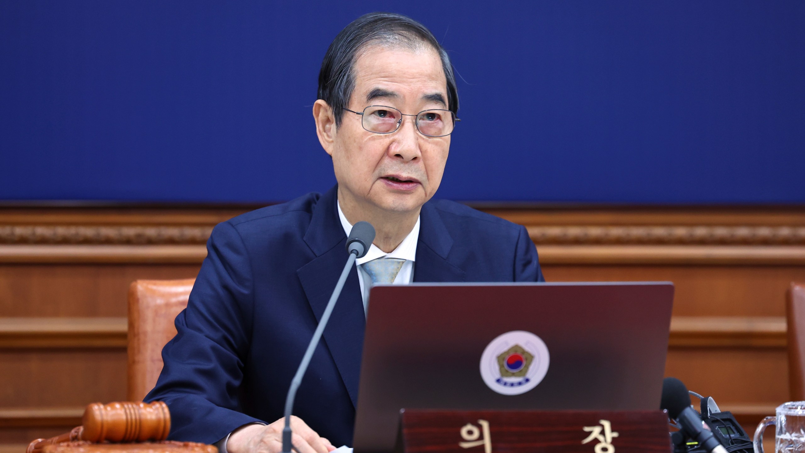 South Korea's Prime Minister Han Duck-soo, who became the country's acting leader after President Yoon Suk Yeol's impeachment, speaks during a cabinet meeting at the government complex in Seoul, South Korea, Tuesday, Dec. 24, 2024. (Yonhap via AP)