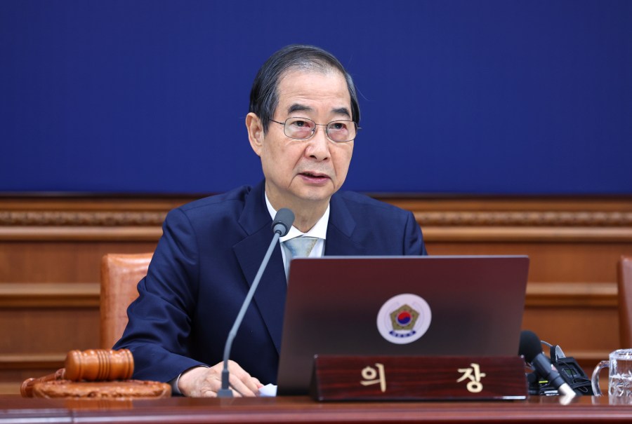 South Korea's Prime Minister Han Duck-soo, who became the country's acting leader after President Yoon Suk Yeol's impeachment, speaks during a cabinet meeting at the government complex in Seoul, South Korea, Tuesday, Dec. 24, 2024. (Yonhap via AP)