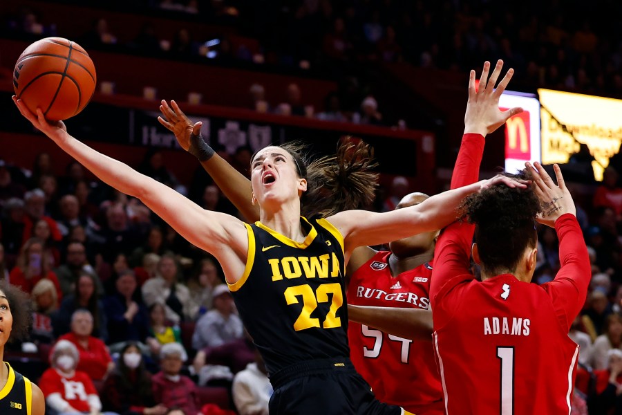 FILE - Iowa guard Caitlin Clark (22) drives to the basket past Rutgers guard Destiny Adams (1) during the first half of an NCAA college basketball game Friday, Jan. 5, 2024, in Piscataway, N.J. (AP Photo/Noah K. Murray, File)