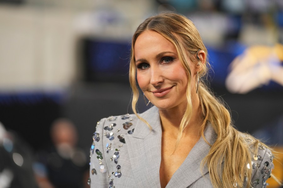 Nikki Glaser stands on the field after NFL football game between the Los Angeles Chargers and the Denver Broncos, Thursday, Dec. 19, 2024, in Inglewood, Calif. (AP Photo/Eric Thayer)