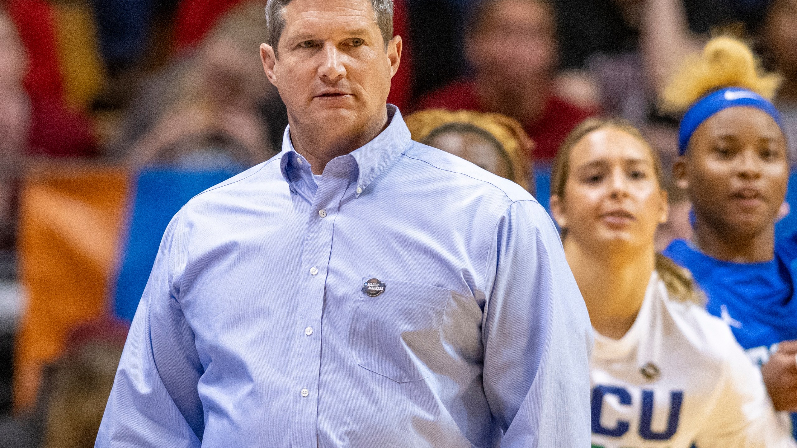 FILE - Florida Gulf Coast head coach Karl Smesko, left, watches play on the court during a first-round college basketball game against Oklahoma in the NCAA Tournament, March 23, 2024, in Bloomington, Ind. (AP Photo/Doug McSchooler, File)