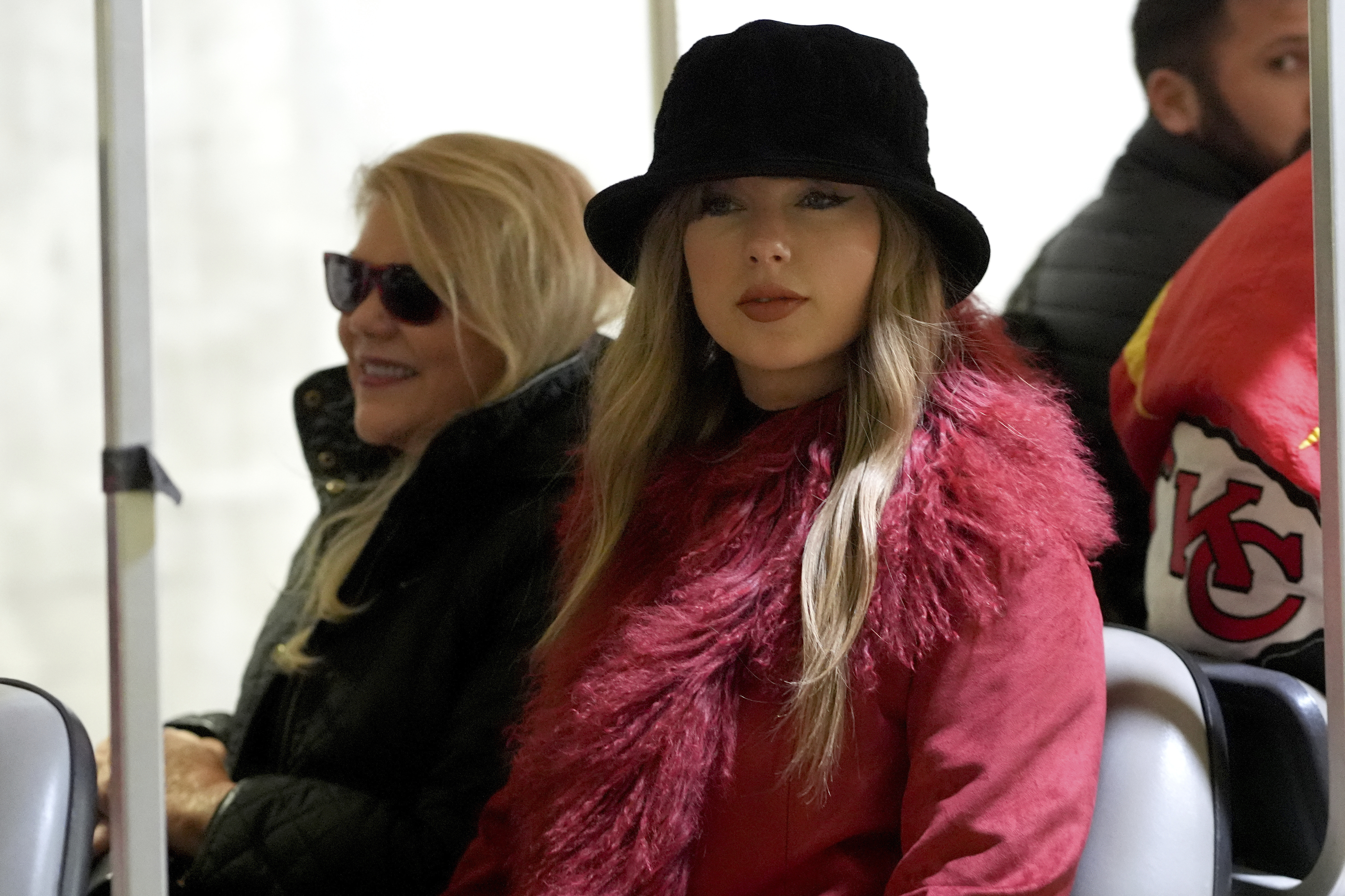 Taylor Swift arrives with her mother, Andrea Swift, before an NFL football game between the Kansas City Chiefs and the Houston Texans Saturday, Dec. 21, 2024, in Kansas City, Mo. (AP Photo/Ed Zurga)