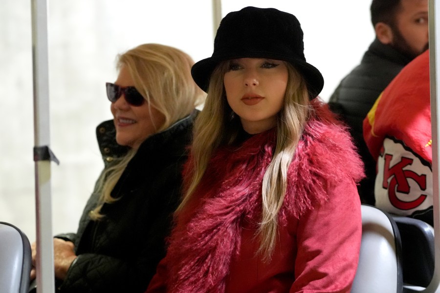 Taylor Swift arrives with her mother, Andrea Swift, before an NFL football game between the Kansas City Chiefs and the Houston Texans Saturday, Dec. 21, 2024, in Kansas City, Mo. (AP Photo/Ed Zurga)