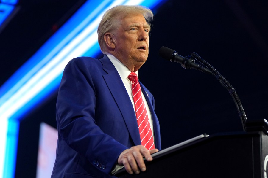 President-elect Donald Trump speaks at AmericaFest, Sunday, Dec. 22, 2024, in Phoenix. (AP Photo/Rick Scuteri)