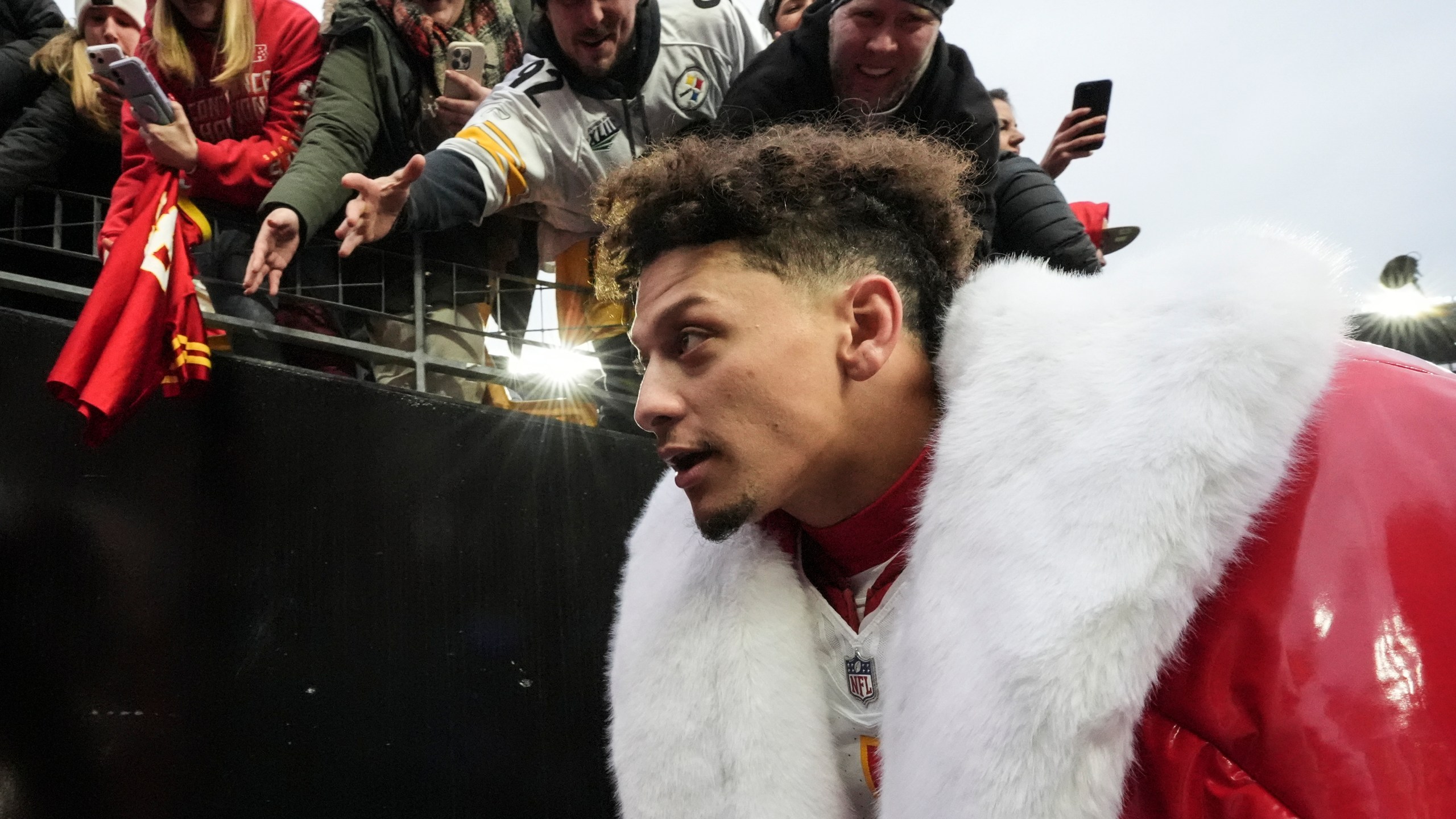 Fans cheer for Kansas City Chiefs quarterback Patrick Mahomes after an NFL football game against the Pittsburgh Steelers, Wednesday, Dec. 25, 2024, in Pittsburgh. (AP Photo/Gene J. Puskar)