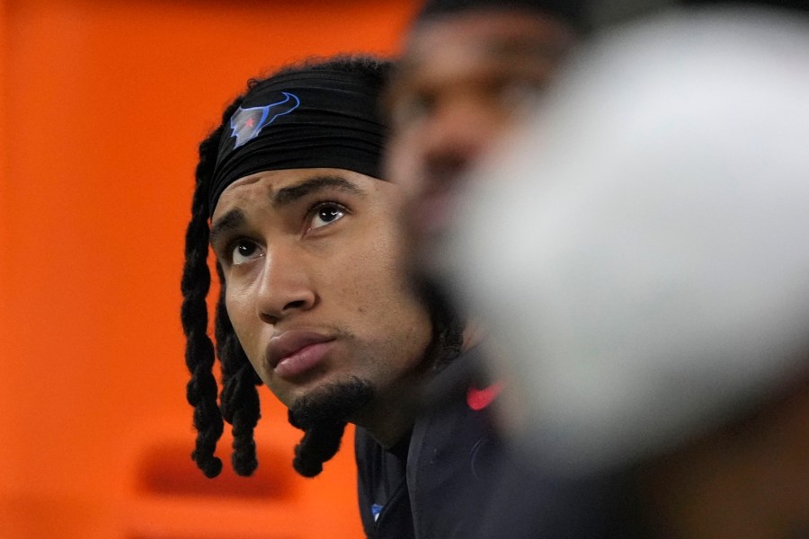 Houston Texans quarterback C.J. Stroud sits on the bench during the second half of an NFL football game against the Baltimore Ravens, Wednesday, Dec. 25, 2024, in Houston. (AP Photo/Eric Christian Smith)