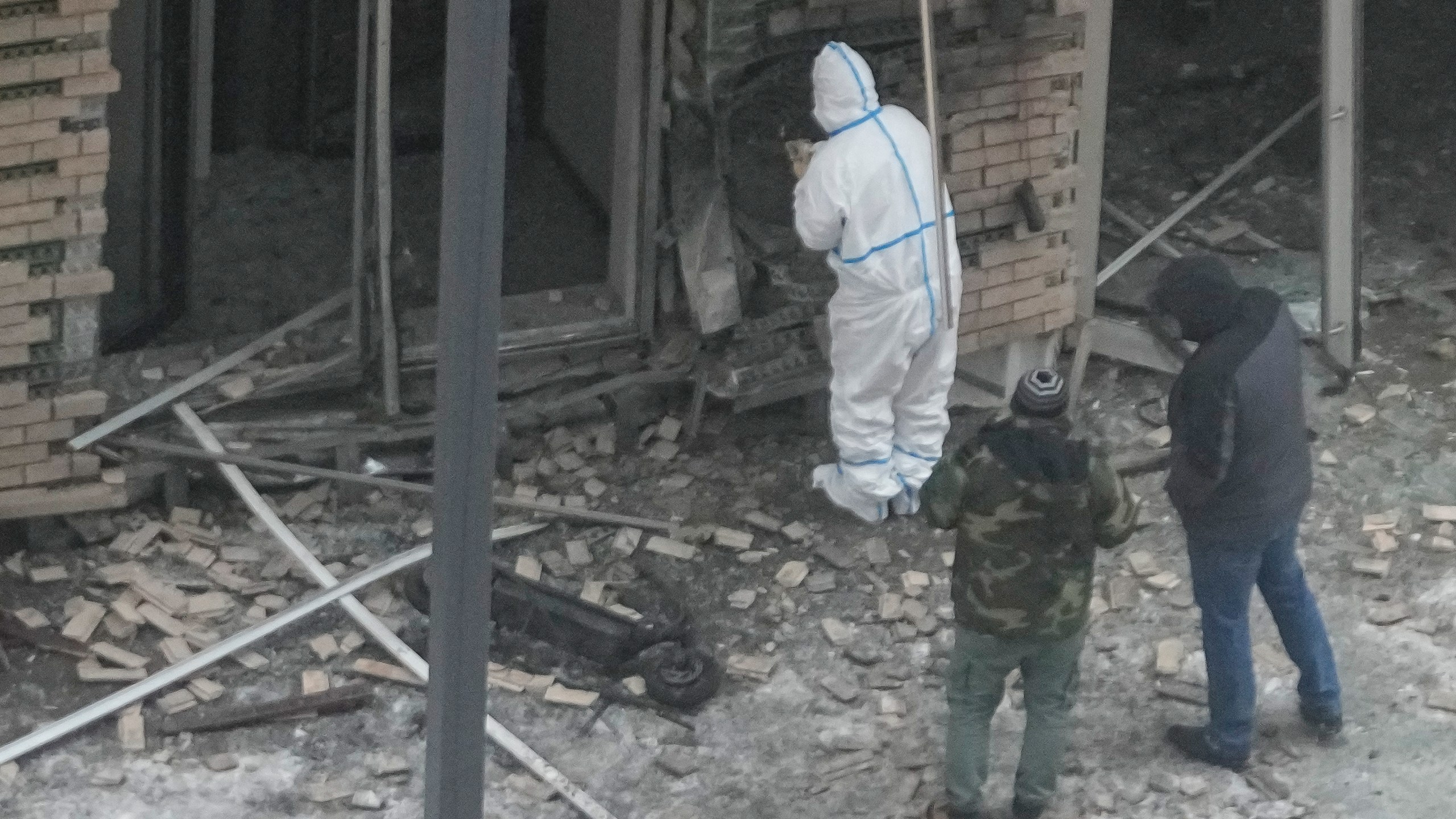 Investigators work near a scooter at the place where Lt. General Igor Kirillov, the head of Russia's Nuclear, Biological, and Chemical Defence Forces and his assistant Ilya Polikarpov were killed by an explosive device planted close to a residential apartment's block in Moscow, Russia, Tuesday, Dec. 17, 2024. (AP Photo)