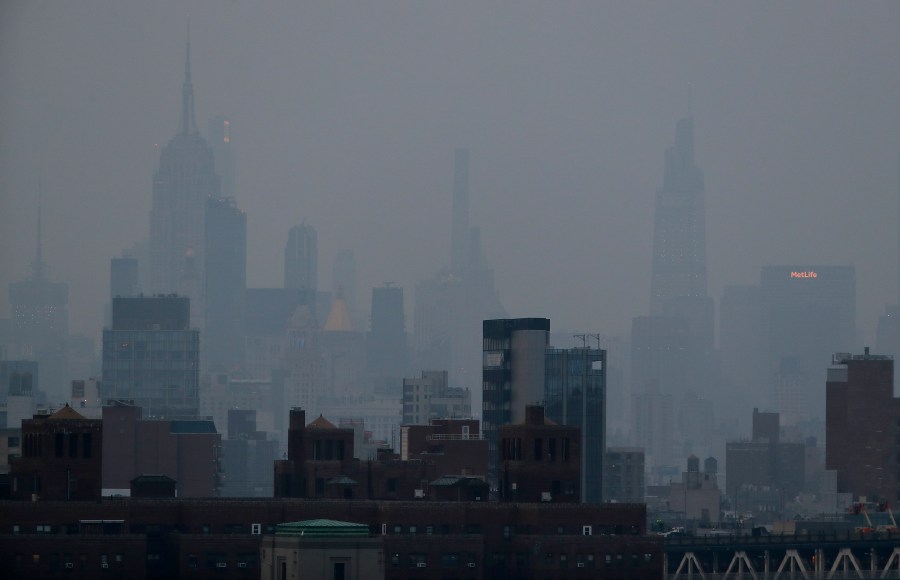 FILE - A thick haze hangs over Manhattan in New York on July 20, 2021. (AP Photo/Julie Jacobson, File)