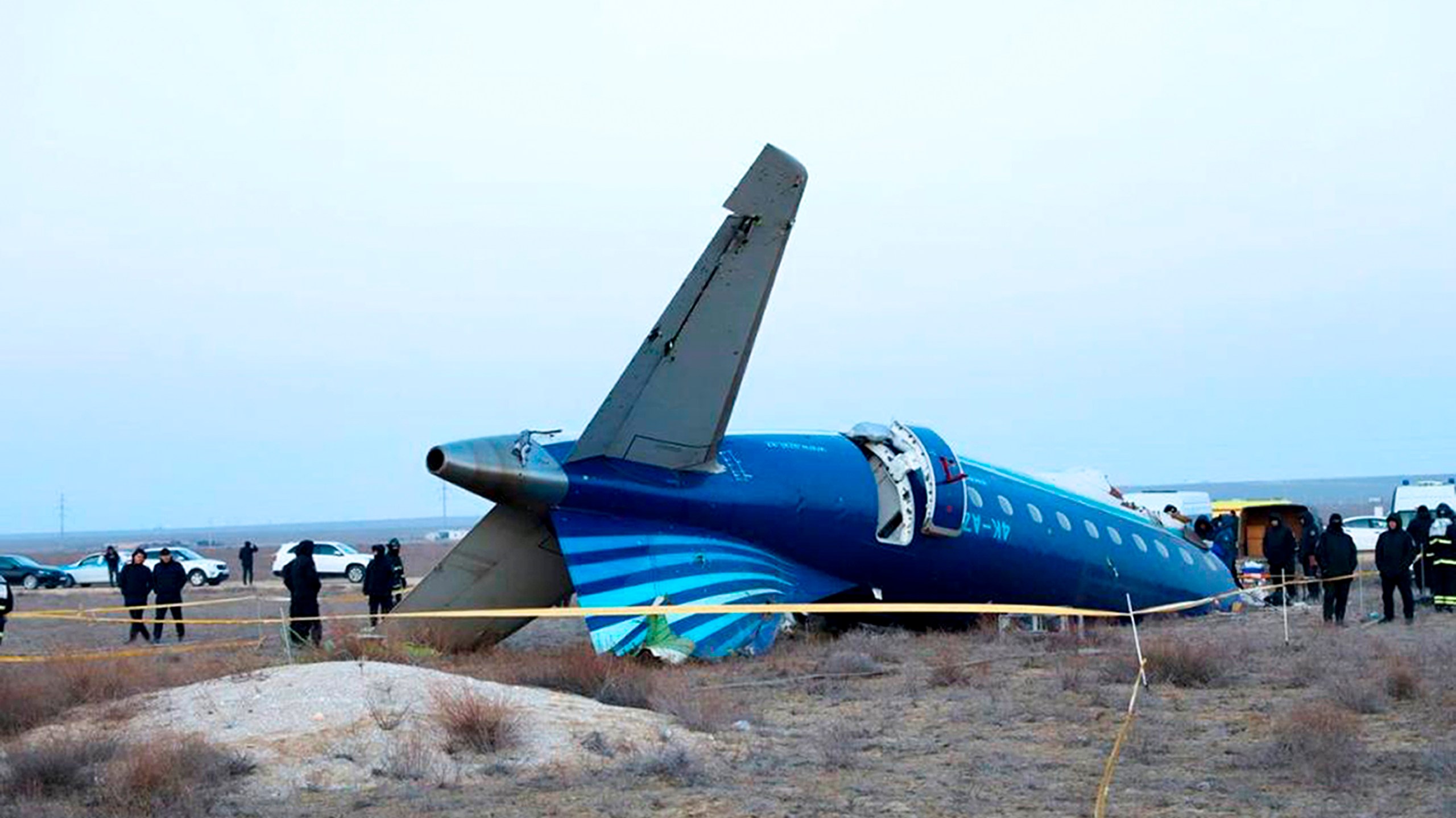 In this photo taken from a video released by the administration of Mangystau region, a part of Azerbaijan Airlines' Embraer 190 lies on the ground near the airport of Aktau, Kazakhstan, on Thursday, Dec. 26, 2024. (The Administration of Mangystau Region via AP)