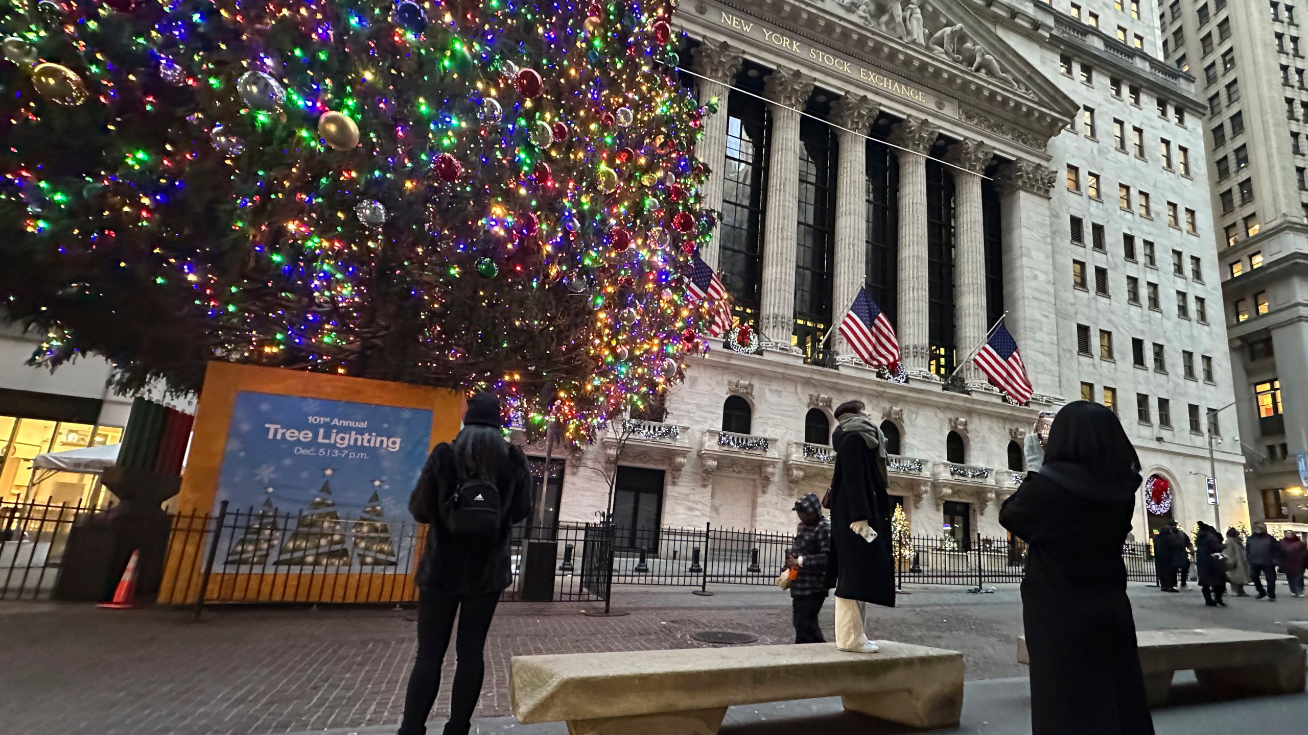 FIL:E - People photograph the New York Stock Exchange in New York's Financial District on Dec. 23, 2024. (AP Photo/Peter Morgan, File)