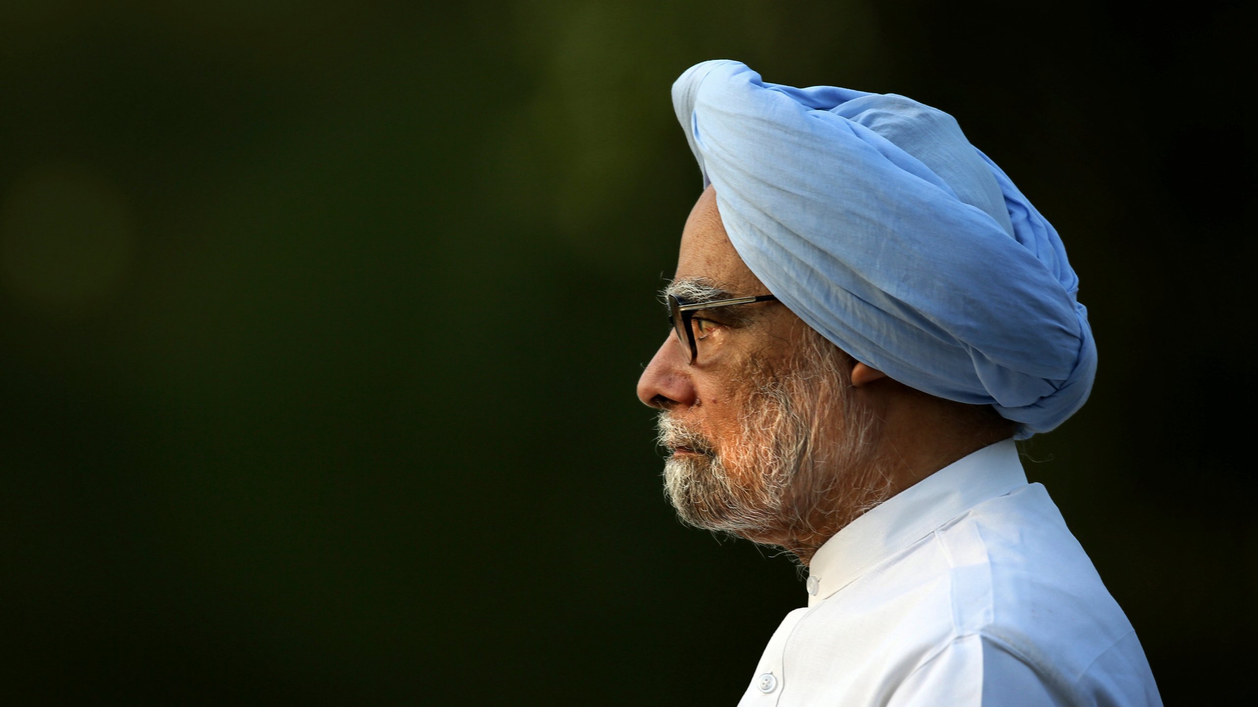 FILE - In this Wednesday, May 21, 2014 file photo, outgoing Indian prime minister Manmohan Singh leaves after paying homage to former Indian prime minister Rajiv Gandhi on his death anniversary, in New Delhi, India. (AP Photo/Manish Swarup, File)