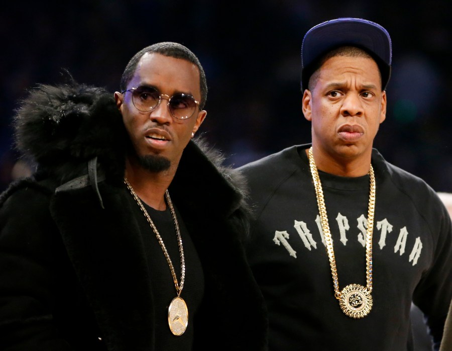 FILE - Rap moguls Sean "Diddy" Combs, left, and Jay-Z attend the NBA All-Star basketball game, Feb. 15, 2015, in New York. (AP Photo/Kathy Willens, File)