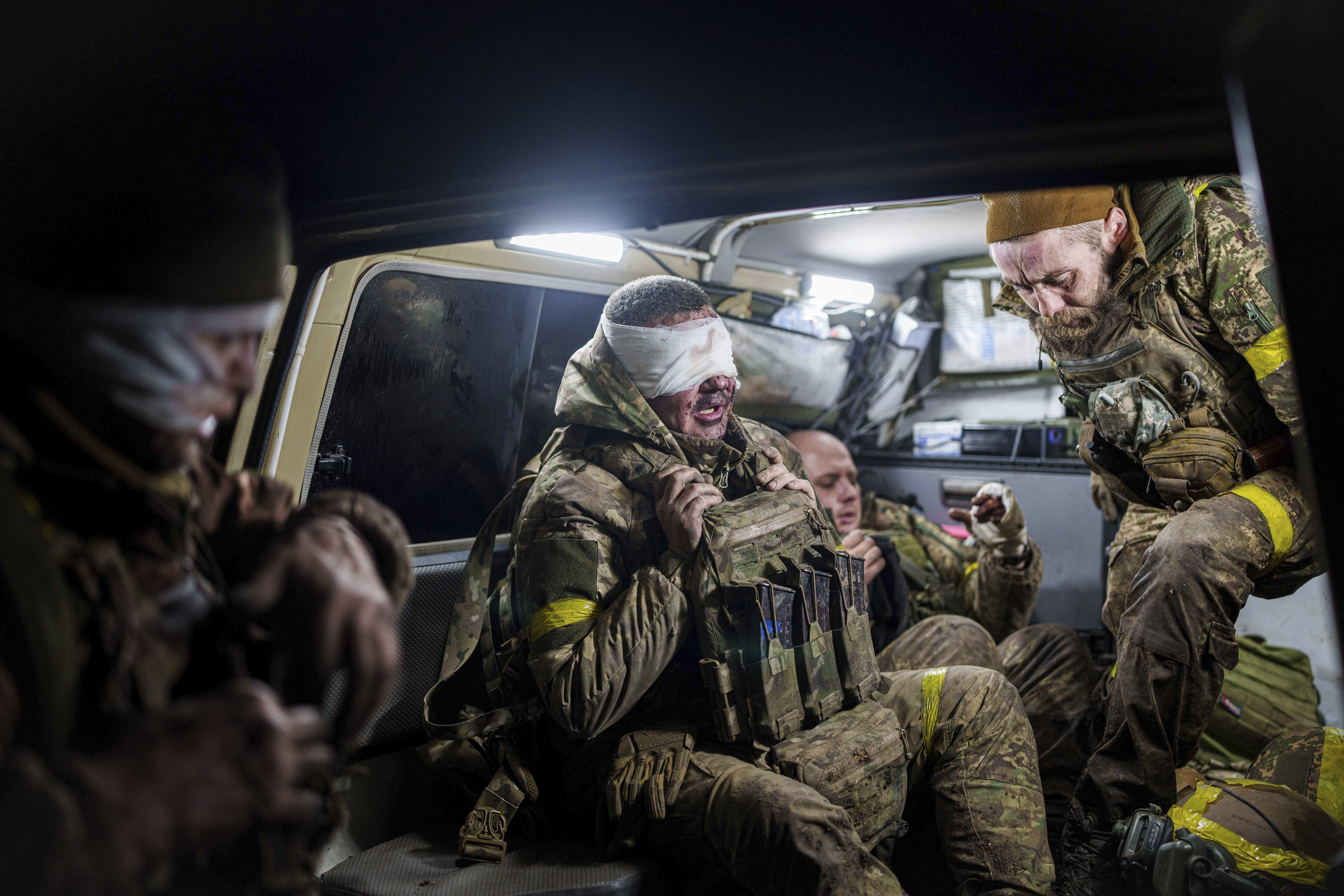 Injured Ukrainian servicemen arrive from the battlefield at Medical Service "Ulf" of the 108th Separate Battalion "Da Vinci Wolves" on Pokrovsk direction, Ukraine, Monday, Dec. 23, 2024. (AP Photo/Evgeniy Maloletka)