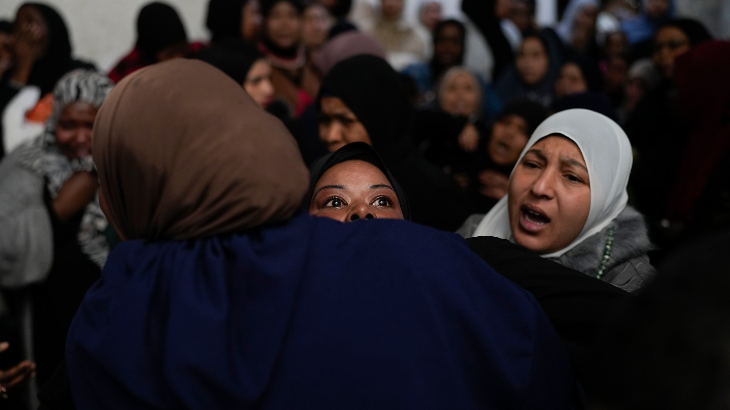 A mourner cries after taking a last look at the body of a relative, one of eight Palestinians killed, during their funeral following the withdrawal of the Israeli army, in the West Bank city of Tulkarem, Thursday, Dec. 26, 2024. (AP Photo/Matias Delacroix)