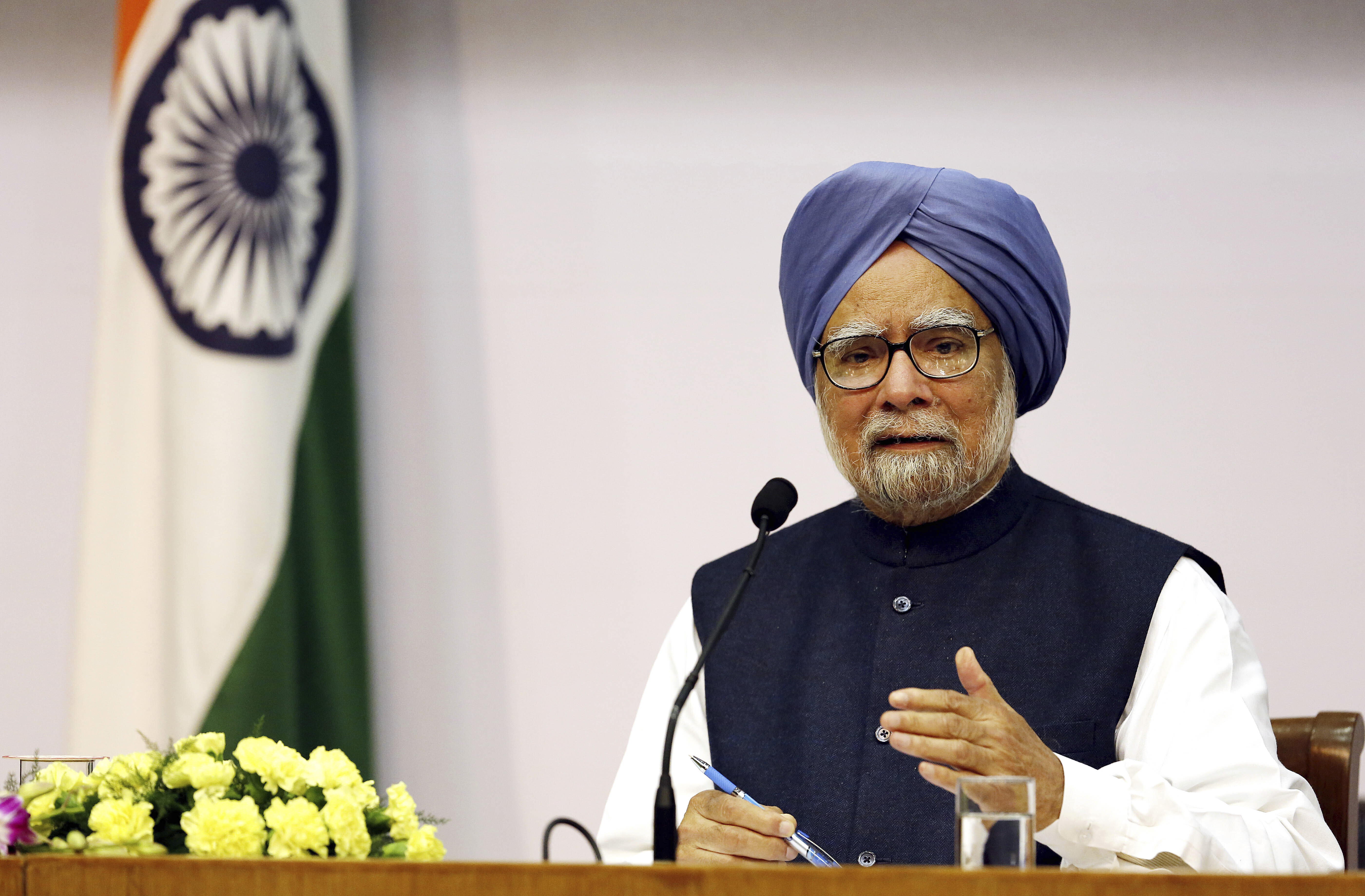 FILE - Indian Prime Minster Manmohan Singh addresses a press conference, in New Delhi, India, Friday, Jan. 3, 2014. (AP Photo/Harish Tyagi, Pool, File)