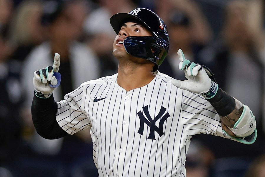 FILE - New York Yankees' Gleyber Torres reacts after hitting a two-run home run against the Kansas City Royals during the third inning Game 1 of the American League baseball division series, Saturday, Oct. 5, 2024, in New York. (AP Photo/Adam Hunger, File)