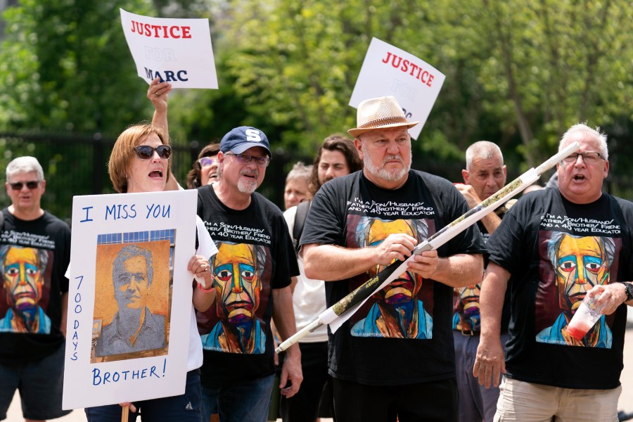 FILE - Lisa Hyland, left, and other family members of Marc Fogel, who has been detained in Russia since August 2021, rally outside the White House for his release, July 15, 2023, in Washington. (AP Photo/Stephanie Scarbrough, File)