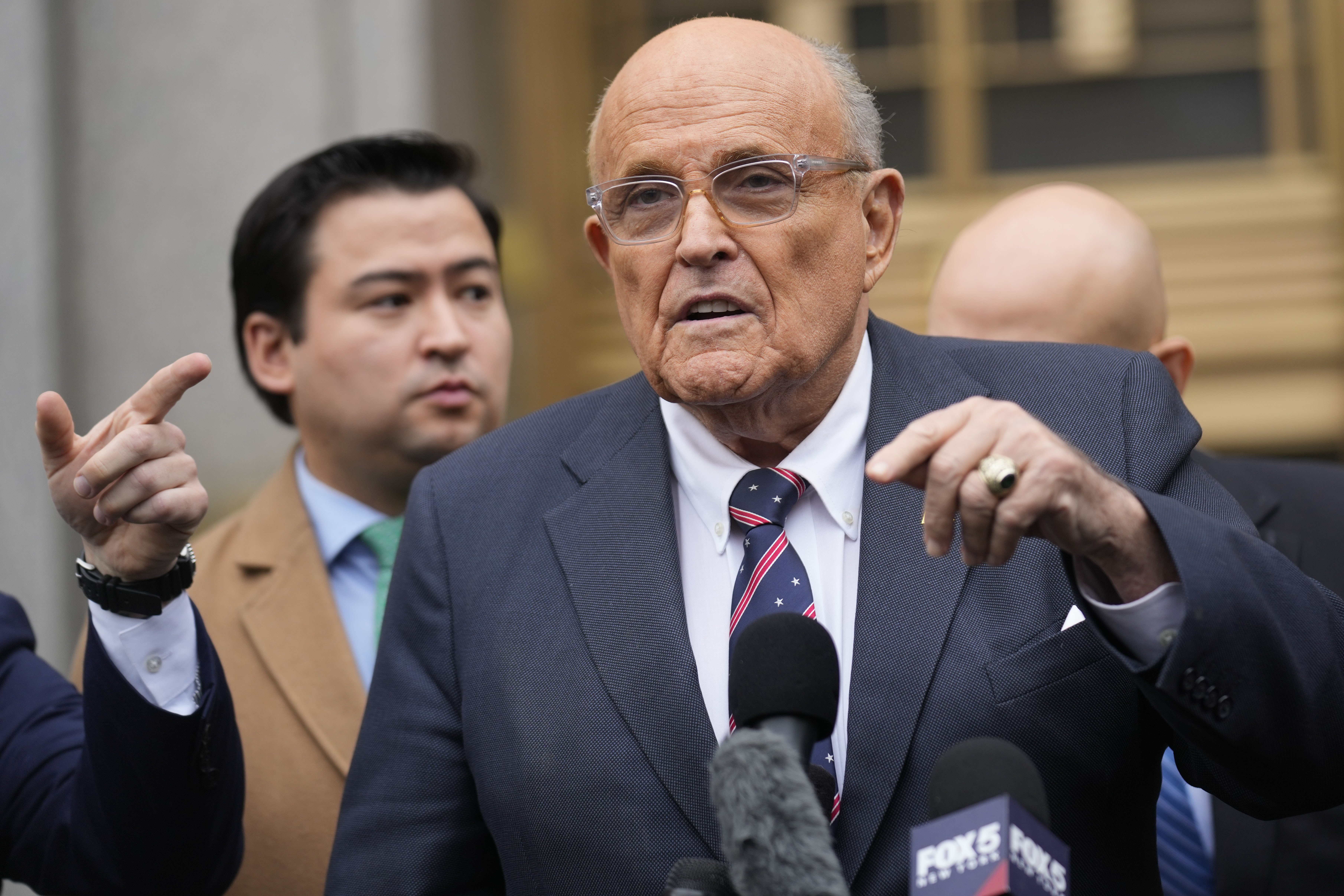 FILE - Rudy Giuliani speaks to reporters as he leaves the federal courthouse in New York, Nov. 26, 2024. (AP Photo/Seth Wenig, File)