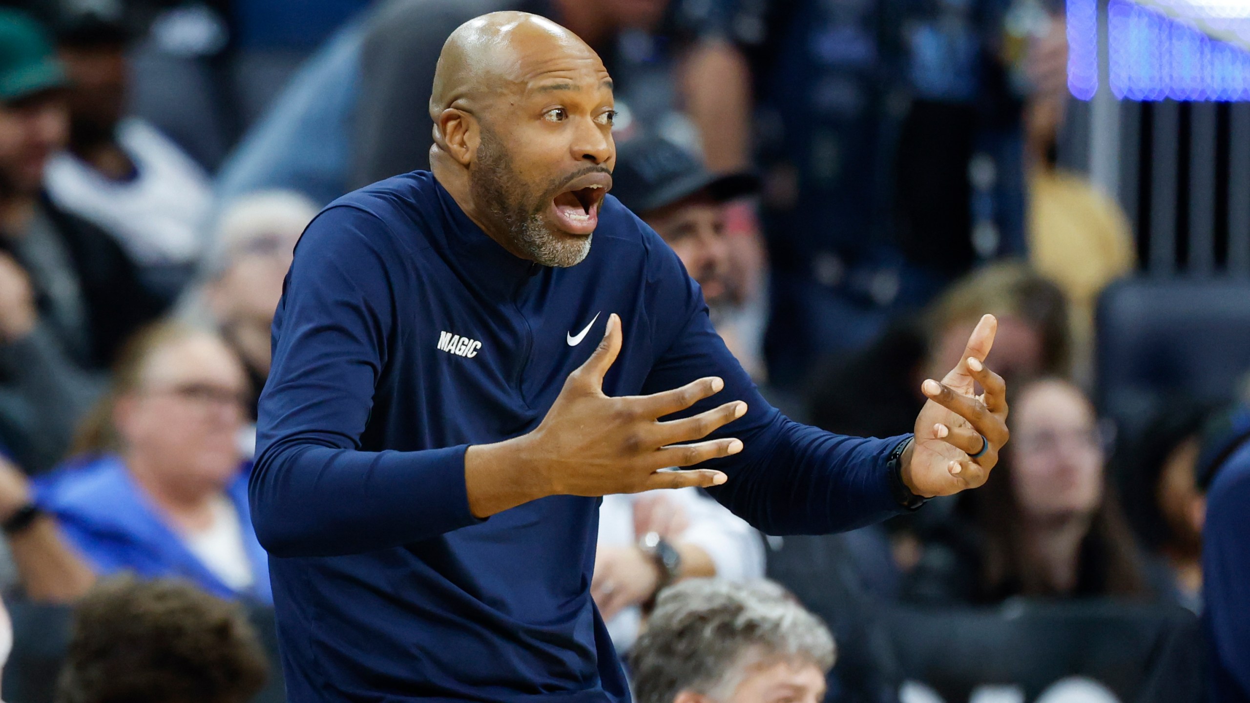 Orlando Magic head coach Jamahl Mosley reacts as his team plays the Miami Heat during the second half of an NBA basketball game, Thursday, Dec. 26, 2024, in Orlando, Fla. (AP Photo/Kevin Kolczynski)