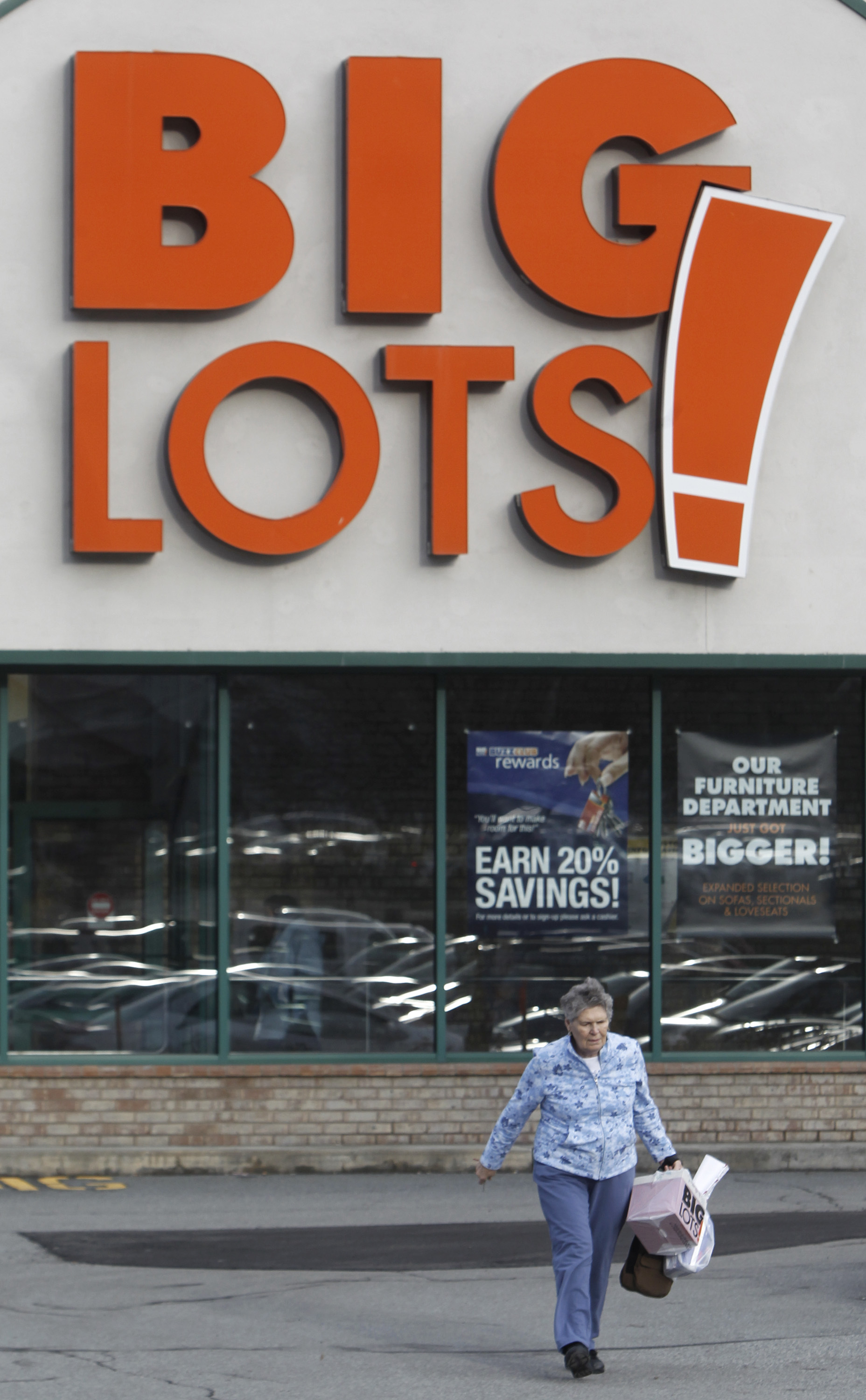 FILE - A shopper leaves the Big Lots store on Dec. 4, 2012 in Berlin, Vt. (AP Photo/Toby Talbot, File)