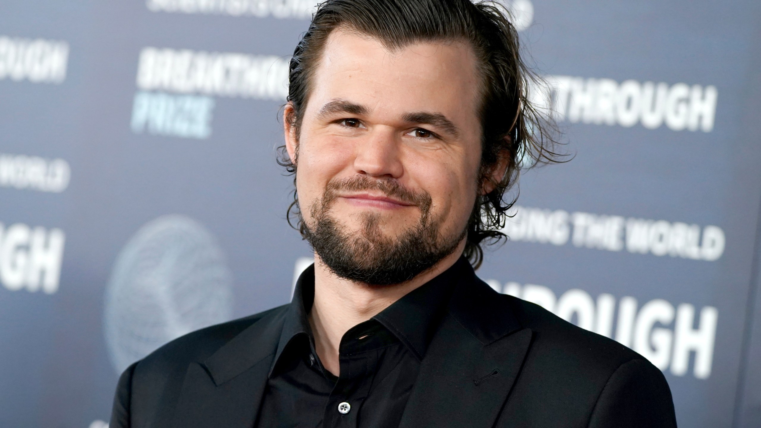 FILE - Magnus Carlsen arrives at the ninth Breakthrough Prize ceremony, April 15, 2023, at The Academy Museum of Motion Pictures in Los Angeles. (Photo by Jordan Strauss/Invision/AP, File)