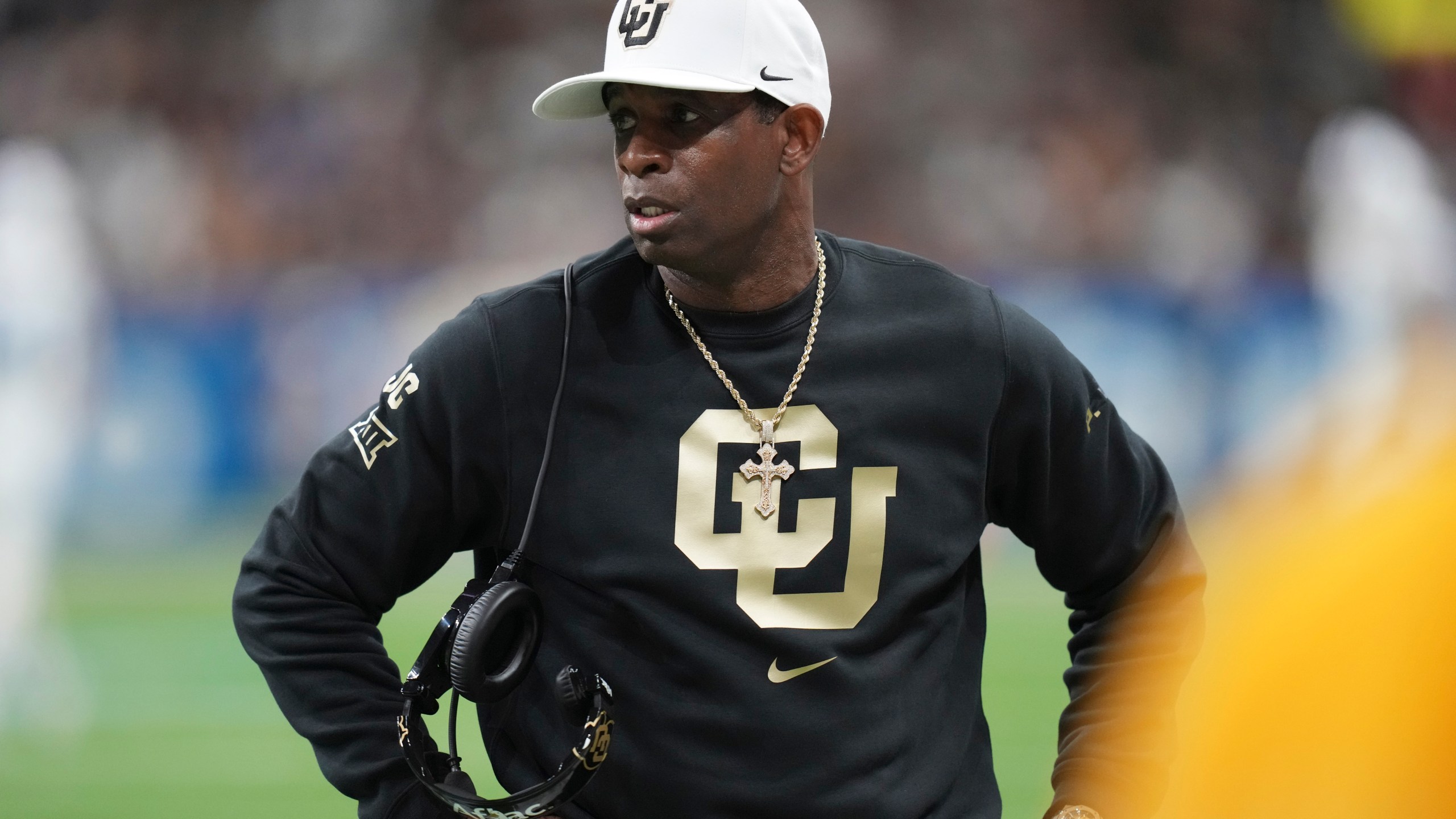 Colorado head coach Deion Sanders watches from the sideline during the first half of the Alamo Bowl NCAA college football game against BYU, Saturday, Dec. 28, 2024, in San Antonio. (AP Photo/Eric Gay)