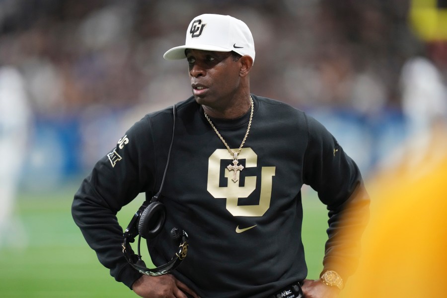 Colorado head coach Deion Sanders watches from the sideline during the first half of the Alamo Bowl NCAA college football game against BYU, Saturday, Dec. 28, 2024, in San Antonio. (AP Photo/Eric Gay)