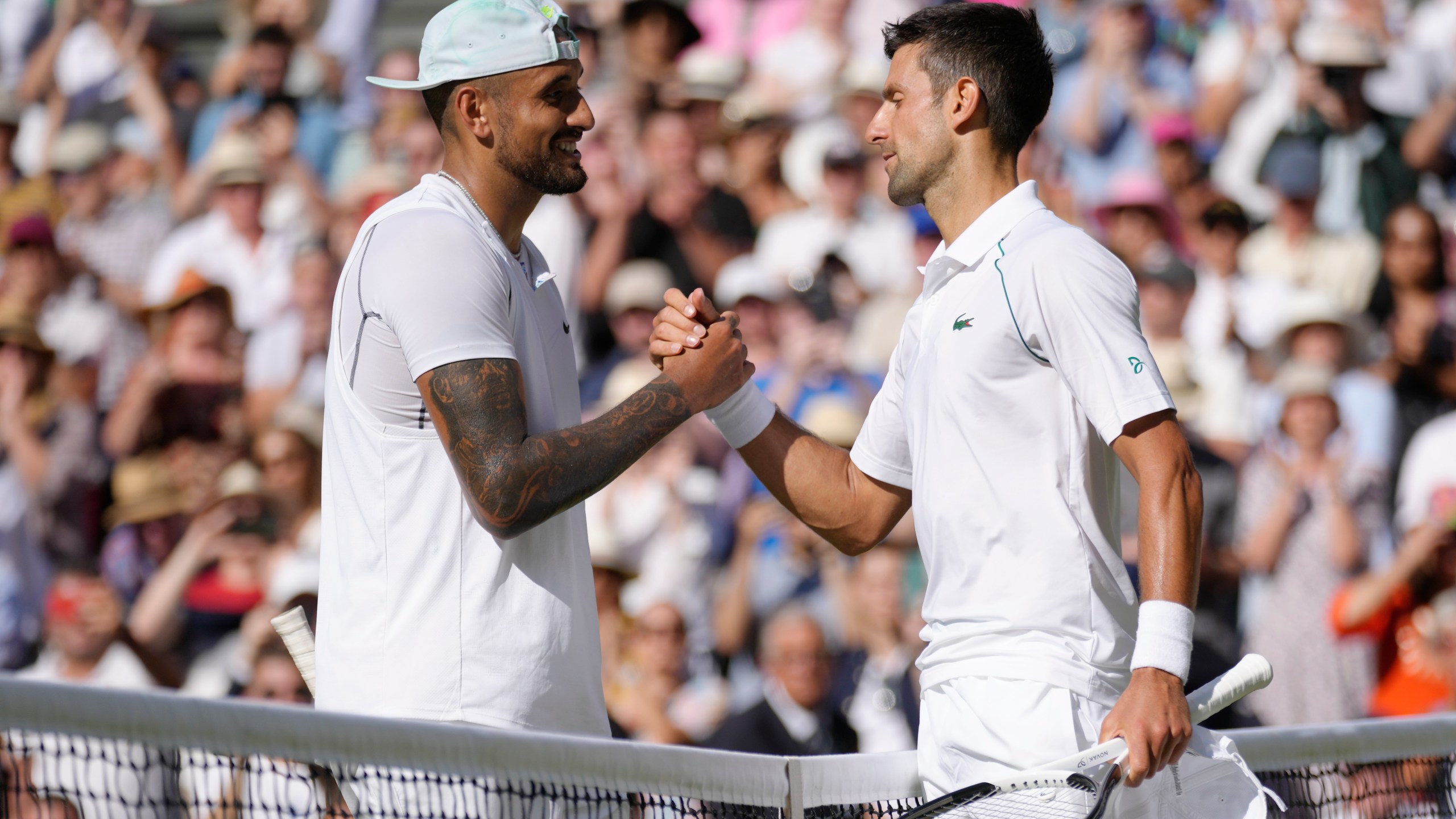 FILE - Serbia's Novak Djokovic, right, celebrates beating Australia's Nick Kyrgios in the final of the men's singles on day fourteen of the Wimbledon tennis championships in London, Sunday, July 10, 2022. (AP Photo/Kirsty Wigglesworth, File)