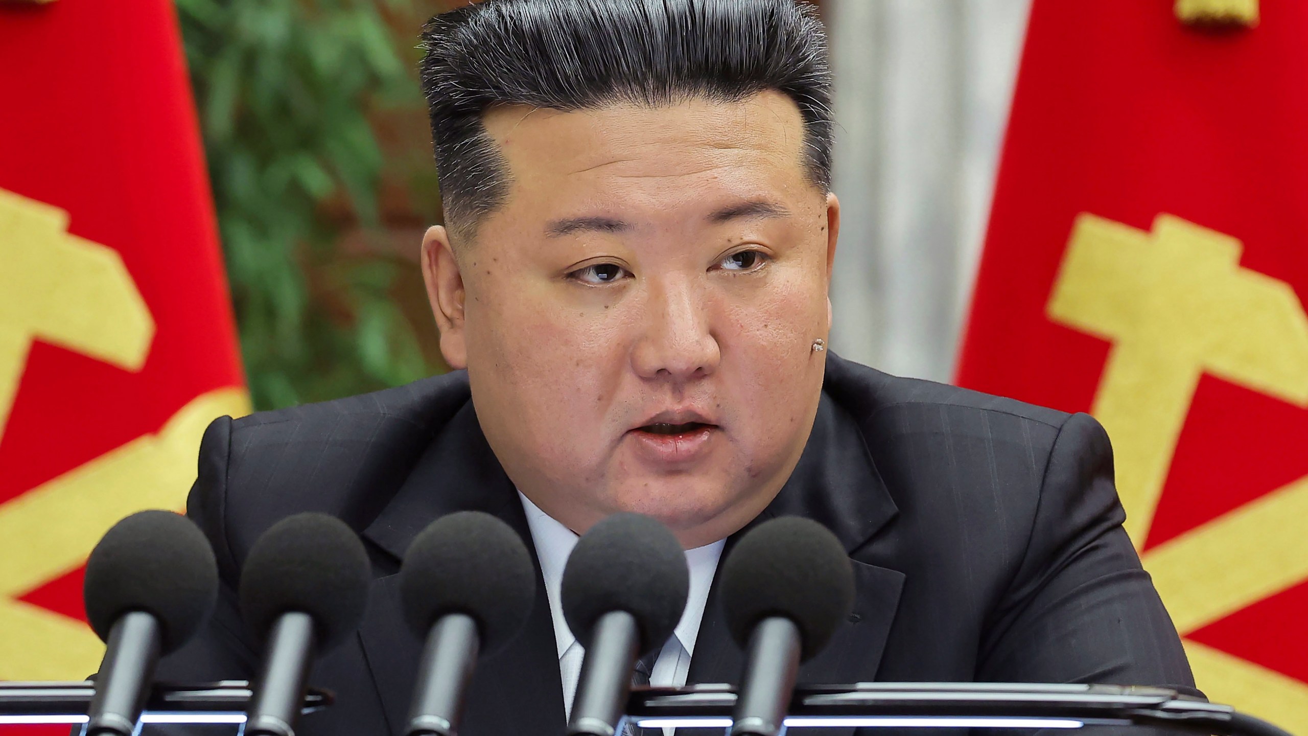 In this photo provided by the North Korean government, North Korean leader Kim Jong Un delivers a speech at a meeting held during Dec. 23 until Dec. 27, 2024, in Pyongyang, North Korea. Independent journalists were not given access to cover the event depicted in this image distributed by the North Korean government. The content of this image is as provided and cannot be independently verified. (Korean Central News Agency/Korea News Service via AP)