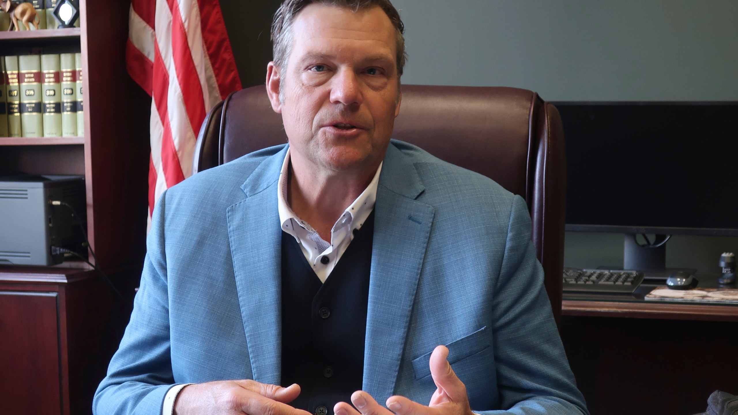 Kansas Attorney General Kris Kobach, a strong support of requiring new voters to provide proof of their U.S. citizenship when registering, answers questions during an interview with The Associated Press, Wednesday, Dec. 18, 2024, in his office in Topeka, Kan. (AP Photo/John Hanna)