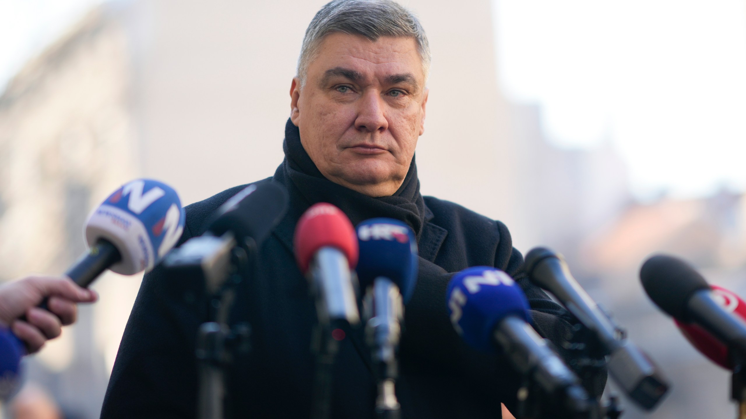 Croatia's President Zoran Milanovic speaks to the media after casting his ballot during presidential elections, at a polling station in Zagreb, Croatia, Sunday, Dec. 29, 2024. (AP Photo/Darko Bandic)