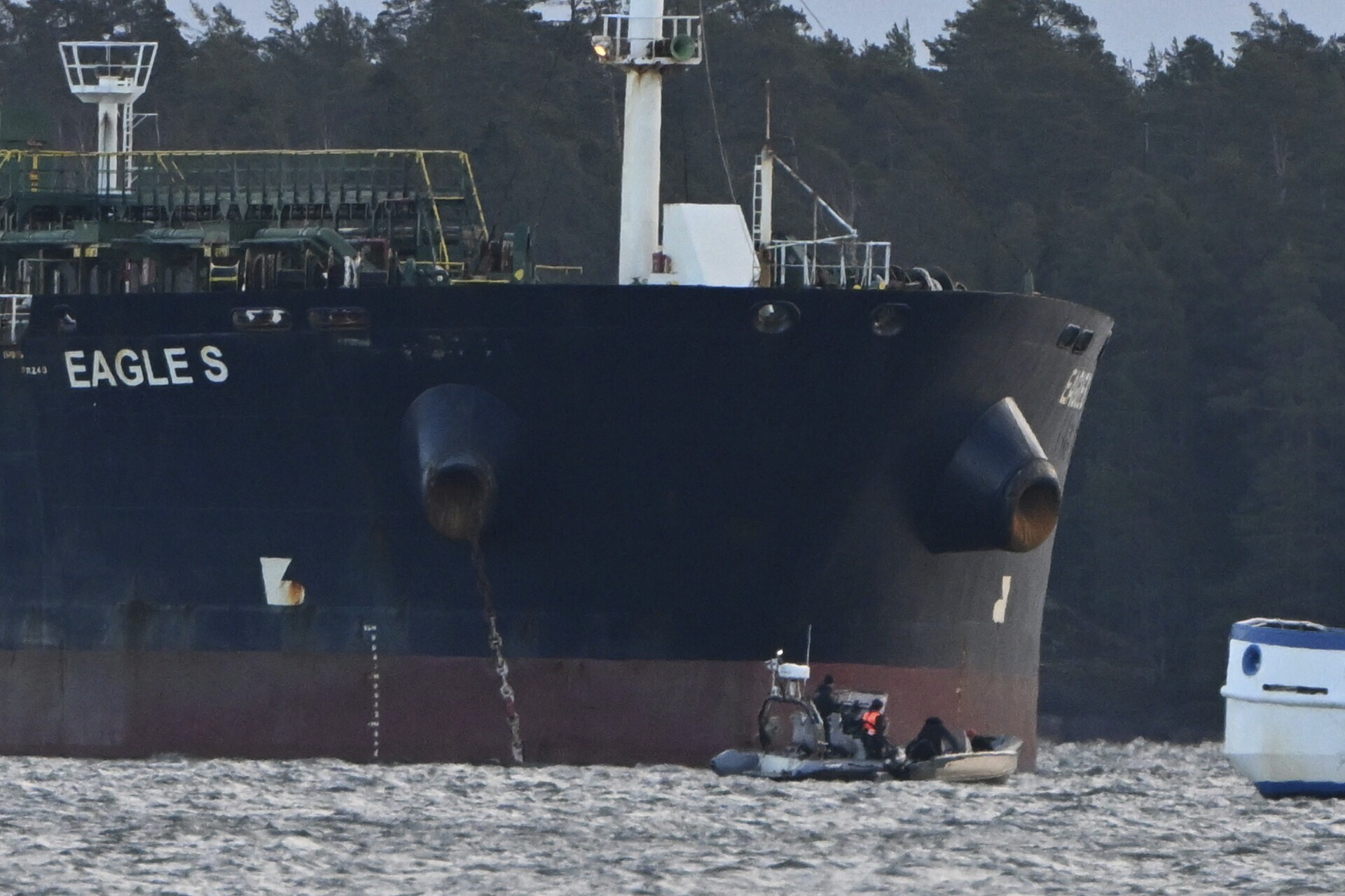 Finnish Coast Guard stopped a small boat which tried to reach the Cook Islands-registered oil tanker Eagle S anchored near the Kilpilahti port in Porvoo, on the Gulf of Finland, Monday, Dec. 30, 2024. (Jussi Nukari/Lehtikuva via AP)