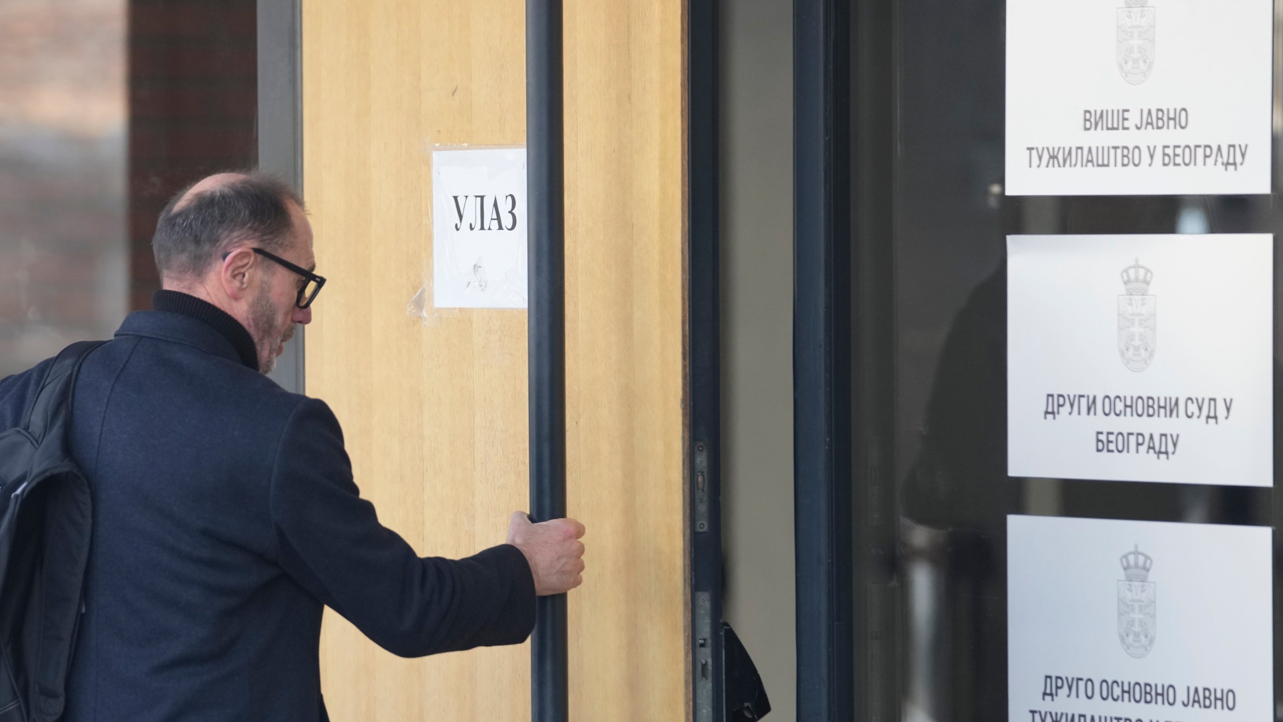 Andjelko Acimovic, father of the murdered Angelina arrives in the court building prior to a verdict in trial of parents of a boy who killed 9 students and security guard in school shooting in 2023, in Belgrade, Serbia, Monday, Dec. 30, 2024. (AP Photo/Darko Vojinovic)