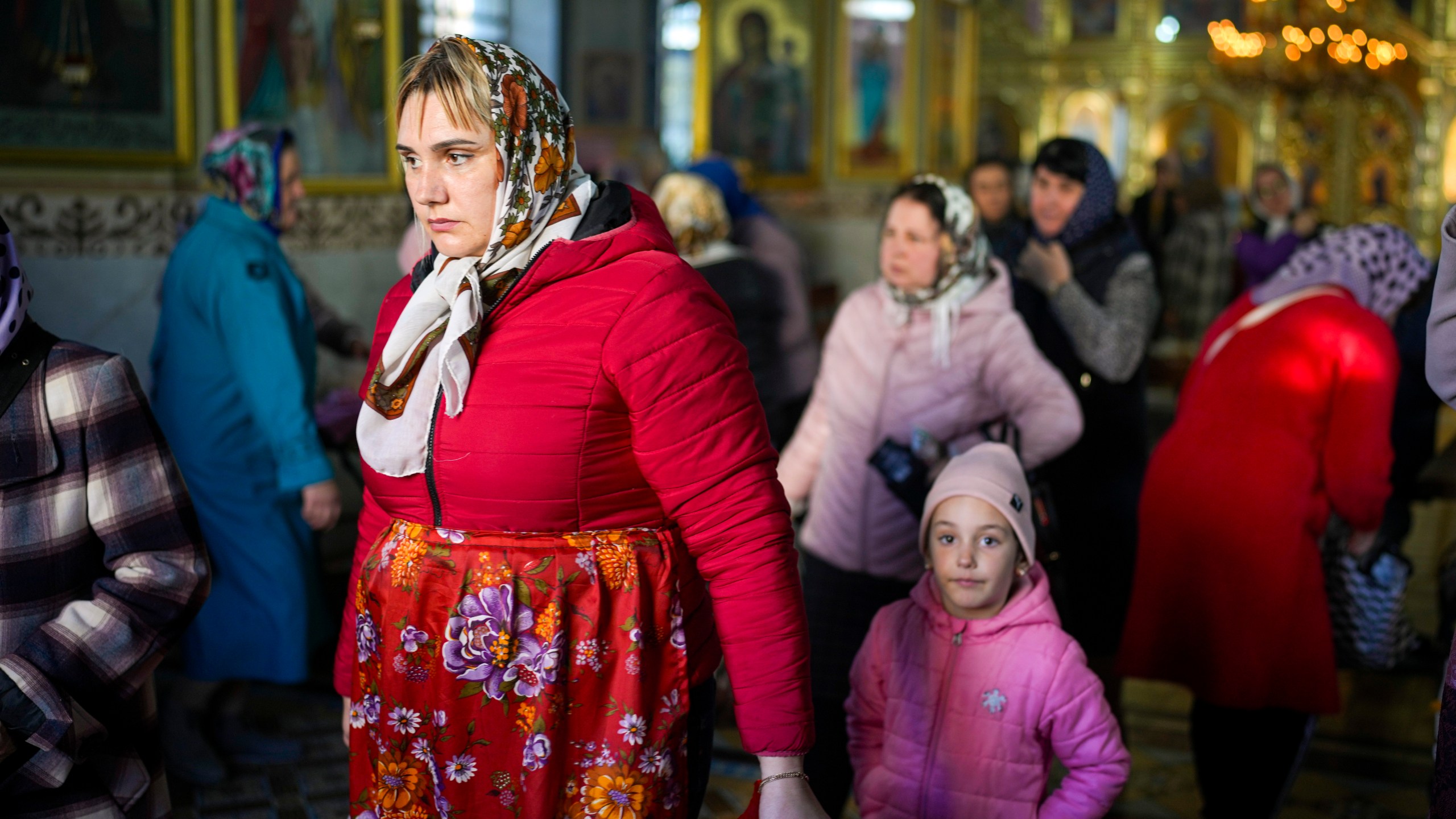 FILE - A woman leaves at the end of a religious service inside the Saint John the Baptist cathedral in Comrat, the capital of Gagauzia, an autonomous part of Moldova, Saturday, Nov. 2, 2024. (AP Photo/Vadim Ghirda, File)