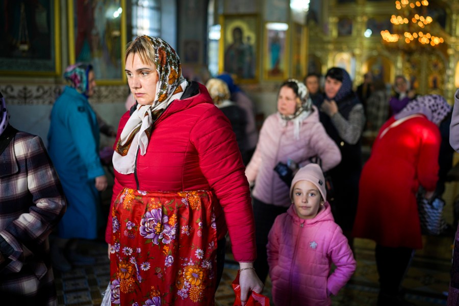 FILE - A woman leaves at the end of a religious service inside the Saint John the Baptist cathedral in Comrat, the capital of Gagauzia, an autonomous part of Moldova, Saturday, Nov. 2, 2024. (AP Photo/Vadim Ghirda, File)