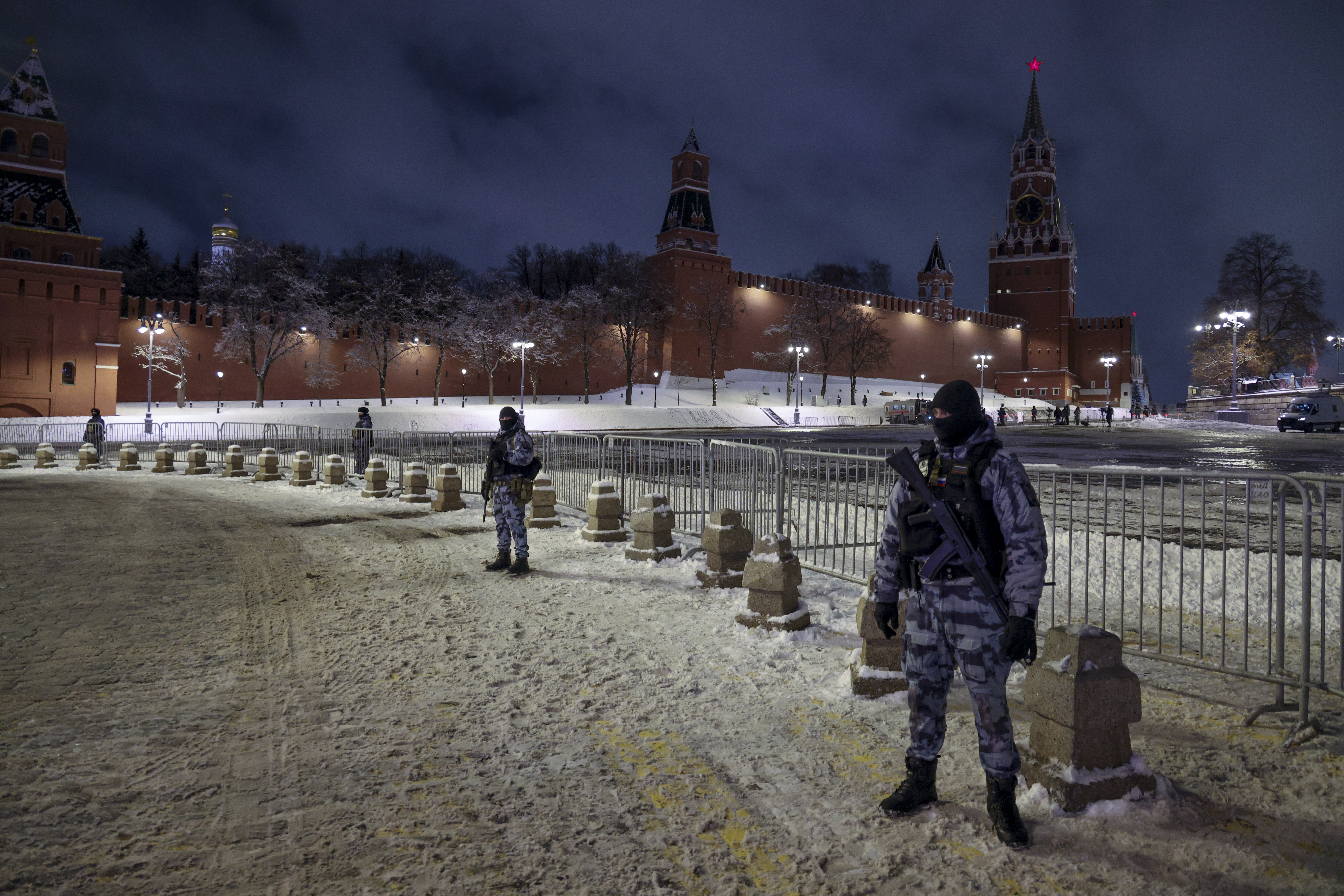 Servicemen of Rosguardia (National Guard) guard an area near Red Square prior to celebrating the New Year's Day, in Moscow, Russia, Tuesday, Dec. 31, 2024. (AP Photo)