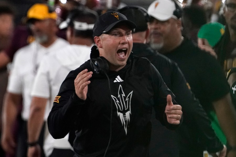 FILE - Arizona State head coach Kenny Dillingham celebrates a touchdown against Kansas during the second half of an NCAA college football game Saturday, Oct. 5, 2024, in Tempe, Ariz. (AP Photo/Darryl Webb, File)