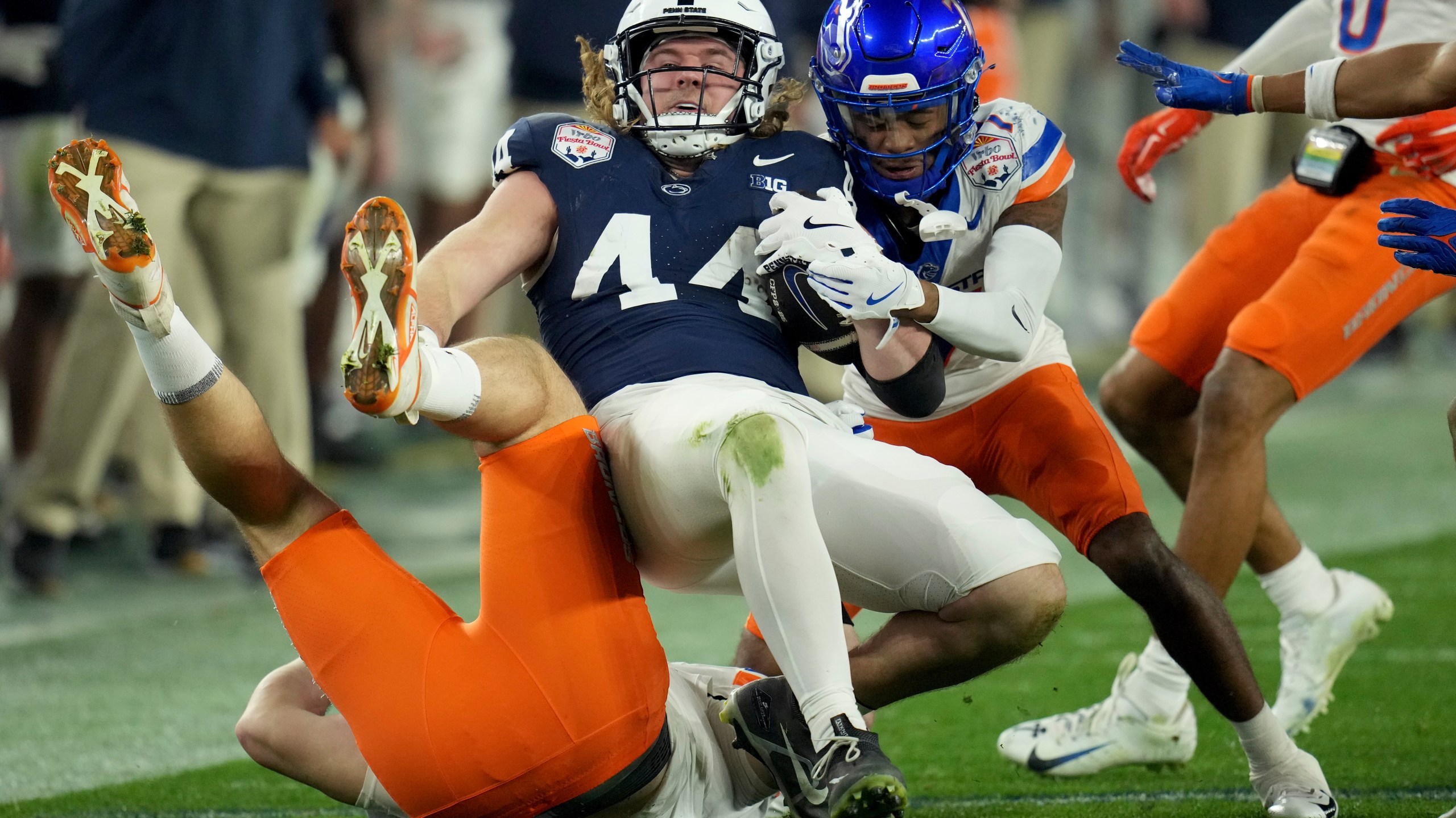 Penn State tight end Tyler Warren (44) is tackled by Boise State defensive end Max Stege (95) during the first half of the Fiesta Bowl NCAA college football CFP quarterfinal game, Tuesday, Dec. 31, 2024, in Glendale, Ariz. (AP Photo/Ross D. Franklin)