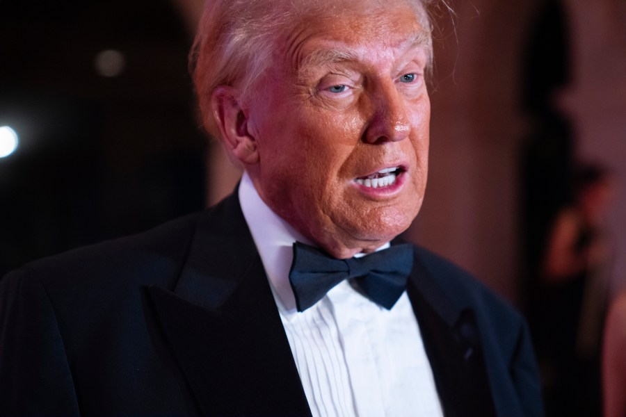 President-elect Donald Trump speaks to reporters before a New Year's Eve party at Mar-a-Lago, Tuesday, Dec. 31, 2024, in Palm Beach, Fla. (AP Photo/Evan Vucci)