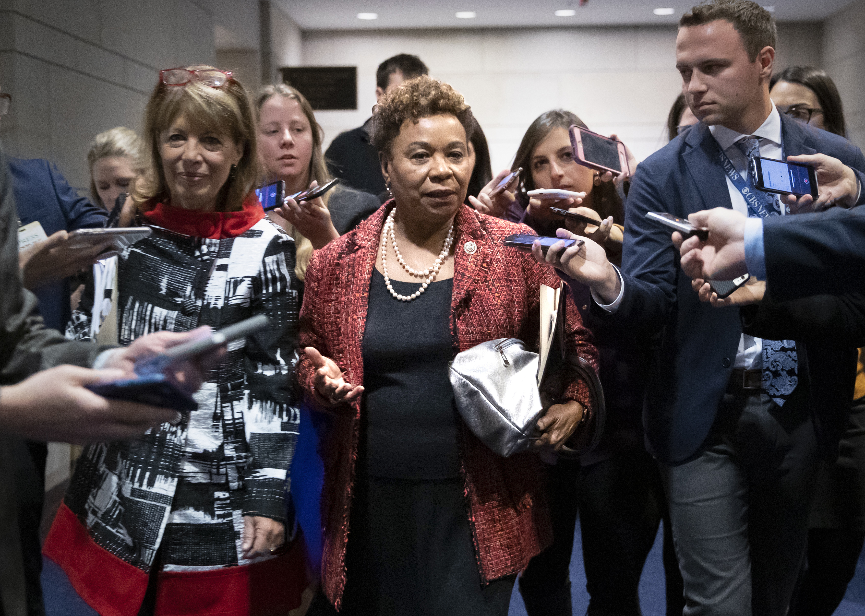 FILE—Rep. Barbara Lee, D-Calif., joined at left by Rep. Jackie Speier, D-Calif., is surrounded by reporters after she lost her bid for House Democratic Caucus chair to Rep. Hakeem Jeffries, D-N.Y., during leadership elections at the Capitol in Washington, Wednesday, Nov. 28, 2018. (AP Photo/J. Scott Applewhite, File)