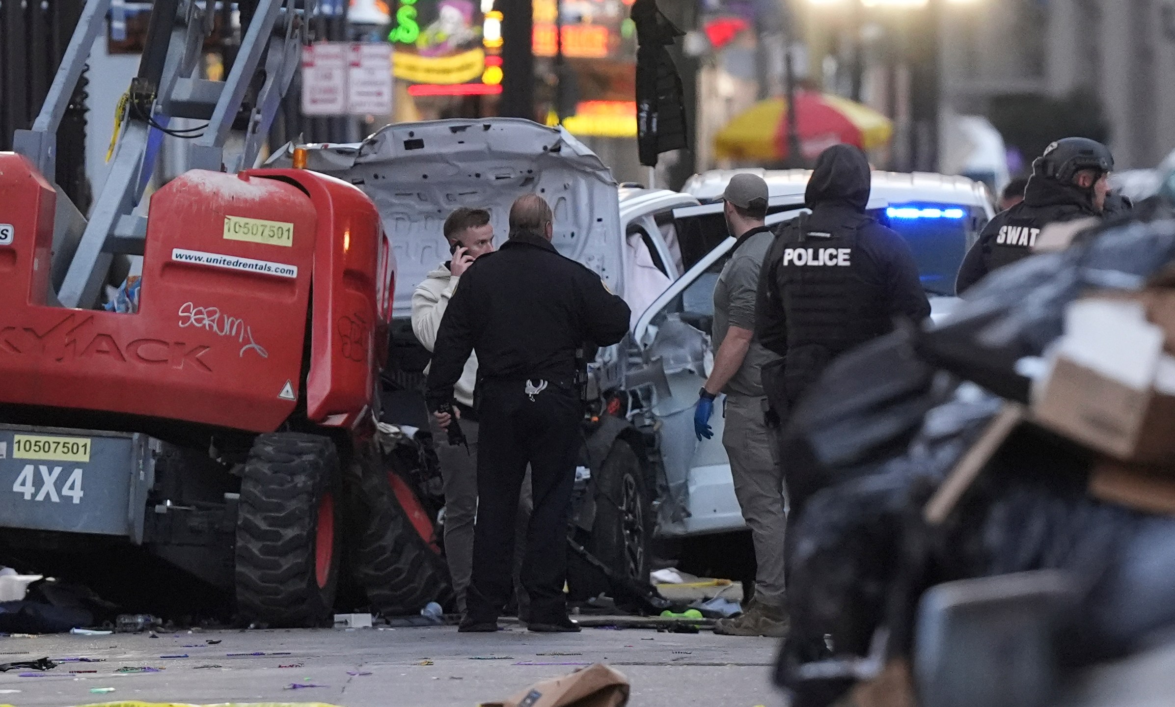 Emergency services attend the scene on Bourbon Street after a vehicle drove into a crowd on New Orleans' Canal and Bourbon Street, Wednesday Jan. 1, 2025. (AP Photo/Gerald Herbert)