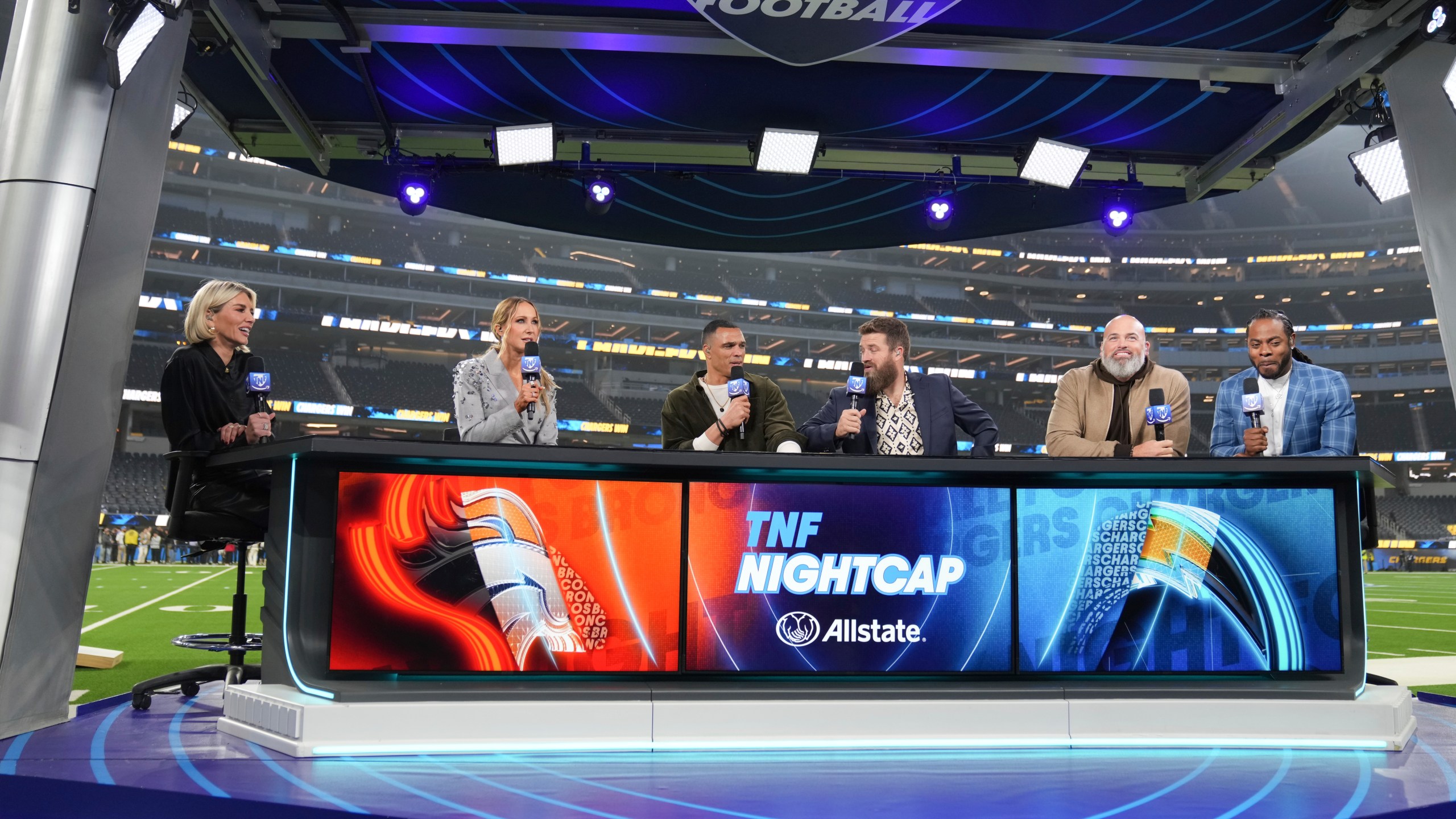 Nikki Glaser, second from left, participates in a segment with the Thursday Night Football crew after an NFL football game between the Los Angeles Chargers and the Denver Broncos, Thursday, Dec. 19, 2024, in Inglewood, Calif. (AP Photo/Eric Thayer)