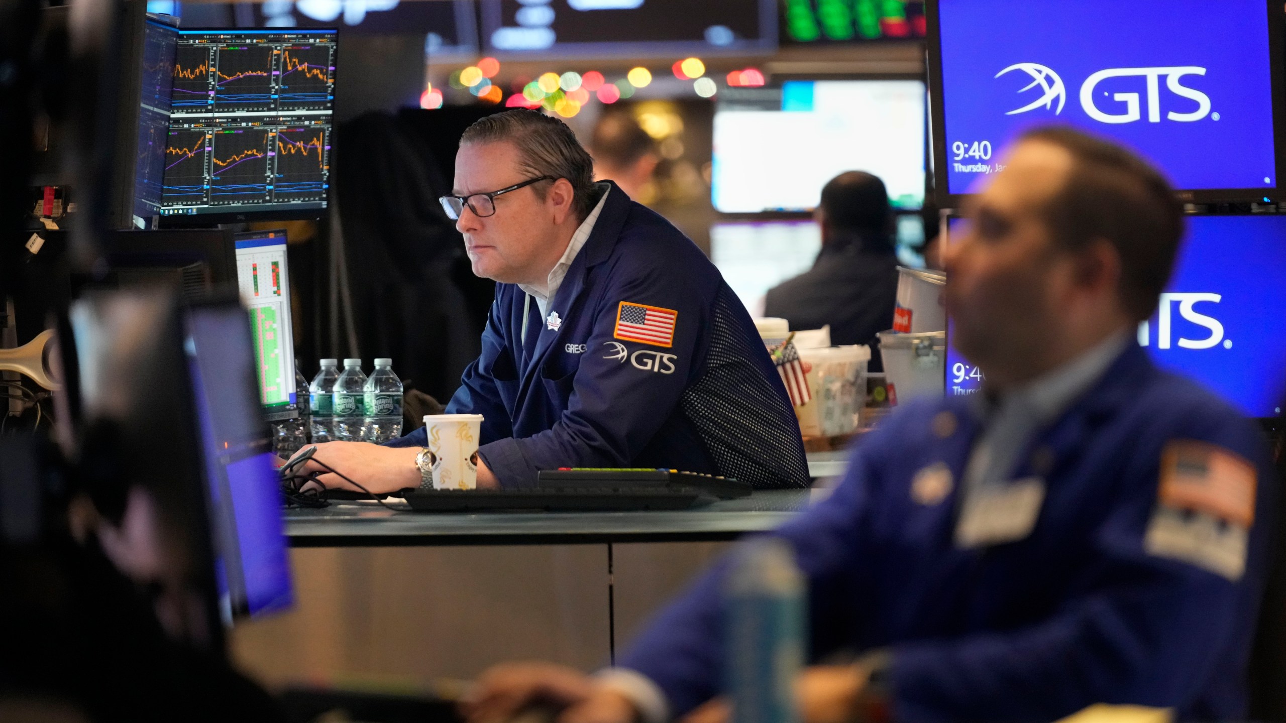 Traders work on the floor at the New York Stock Exchange in New York's Financial District Thursday, Jan. 2, 2025. (AP Photo/Seth Wenig)