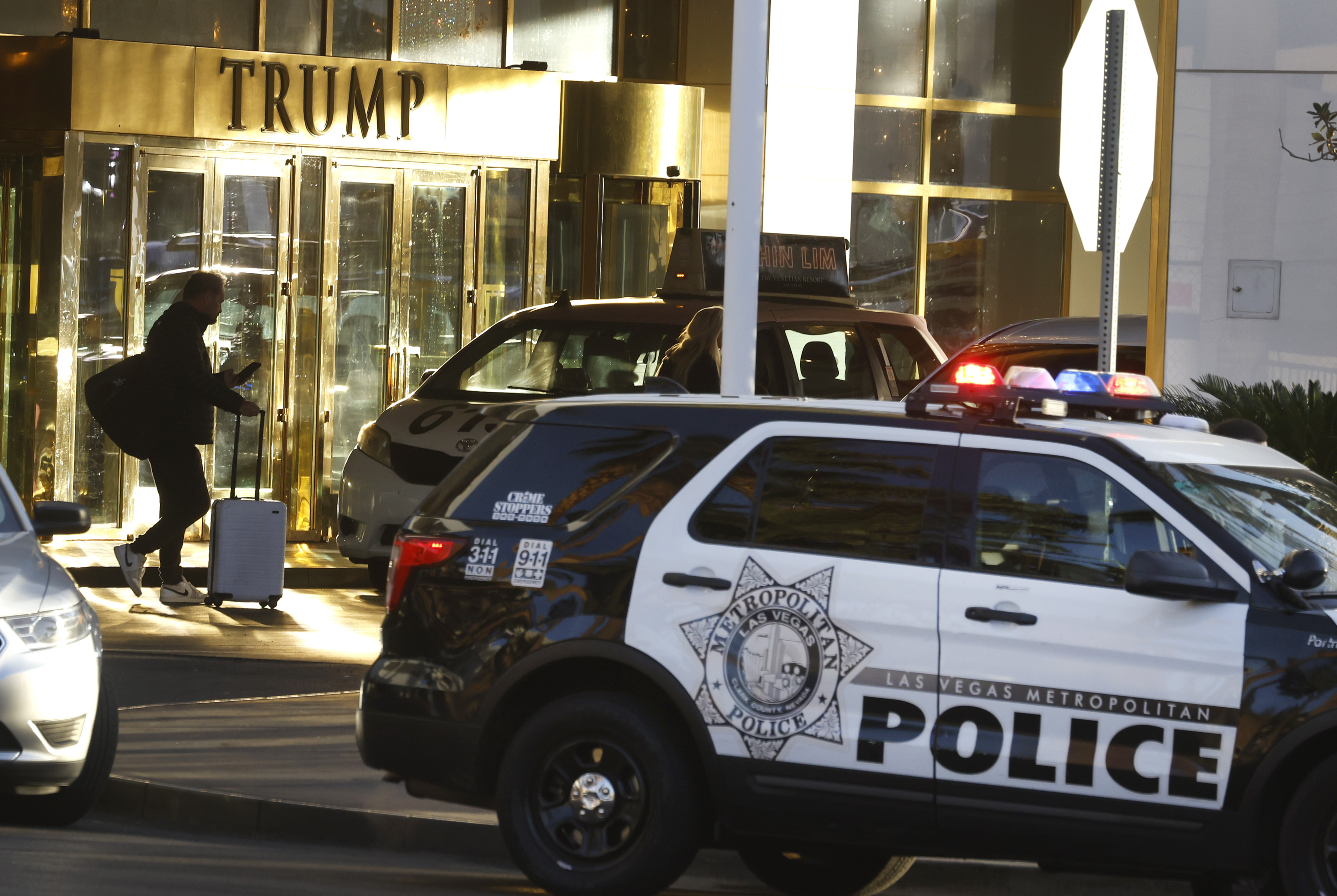 A guest is seen at the valet area outside Trump International Hotel in Las Vegas Thursday, Jan. 2, 2025. (Bizuayehu Tesfaye/Las Vegas Review-Journal via AP)