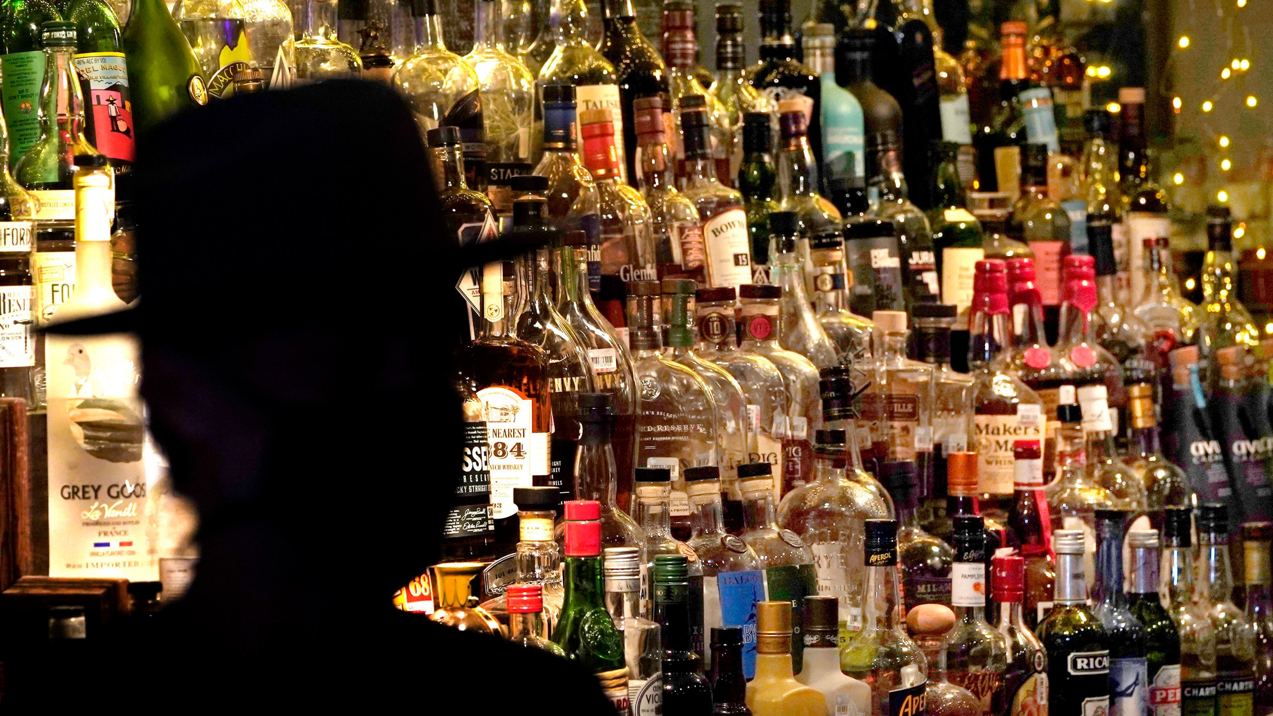 FILE - Bottles of alcohol sit on shelves at a bar in Houston, June 23, 2020. (AP Photo/David J. Phillip, File)