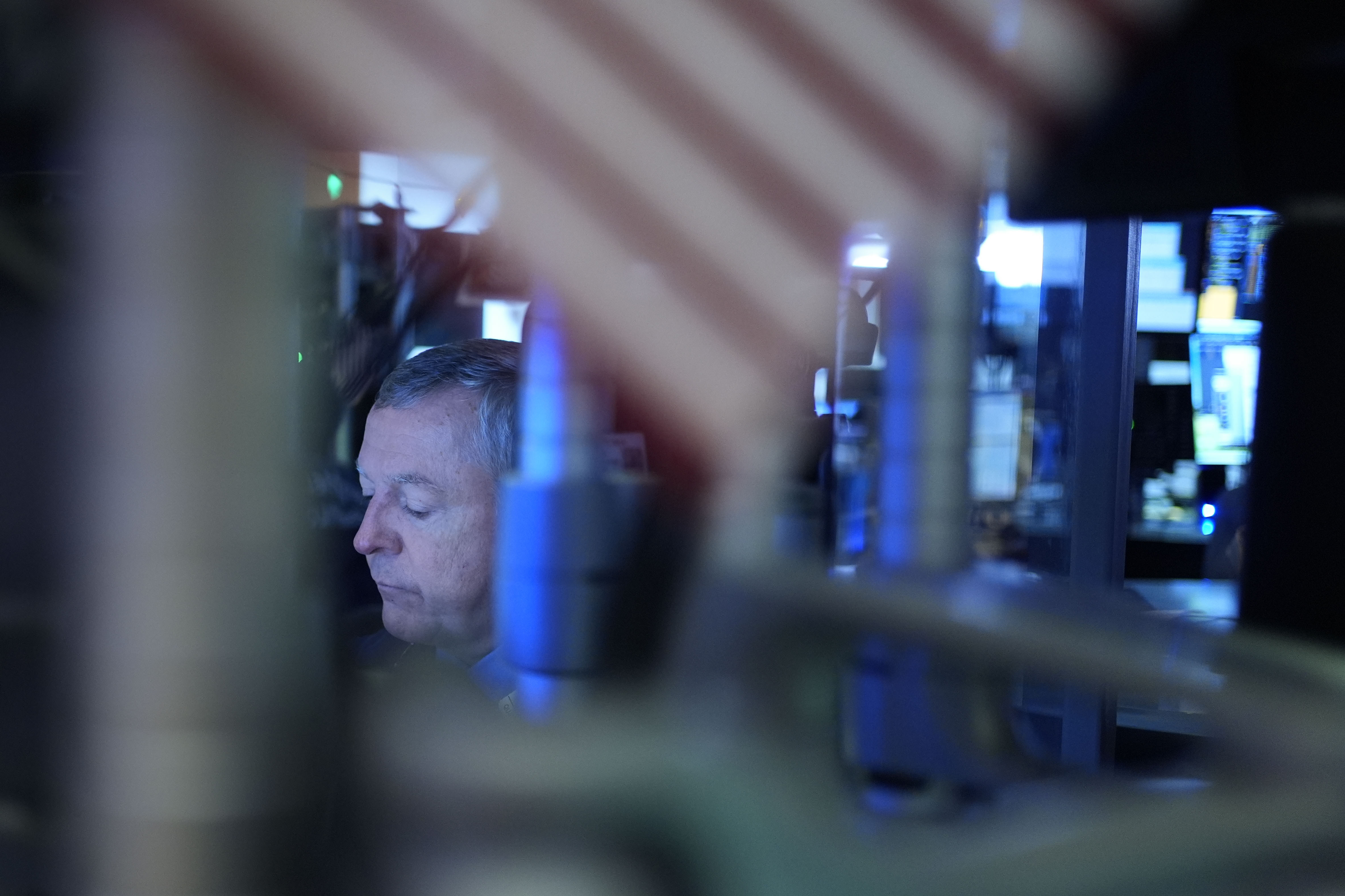 A trader works on the floor at the New York Stock Exchange in New York's Financial District Thursday, Jan. 2, 2025. (AP Photo/Seth Wenig)