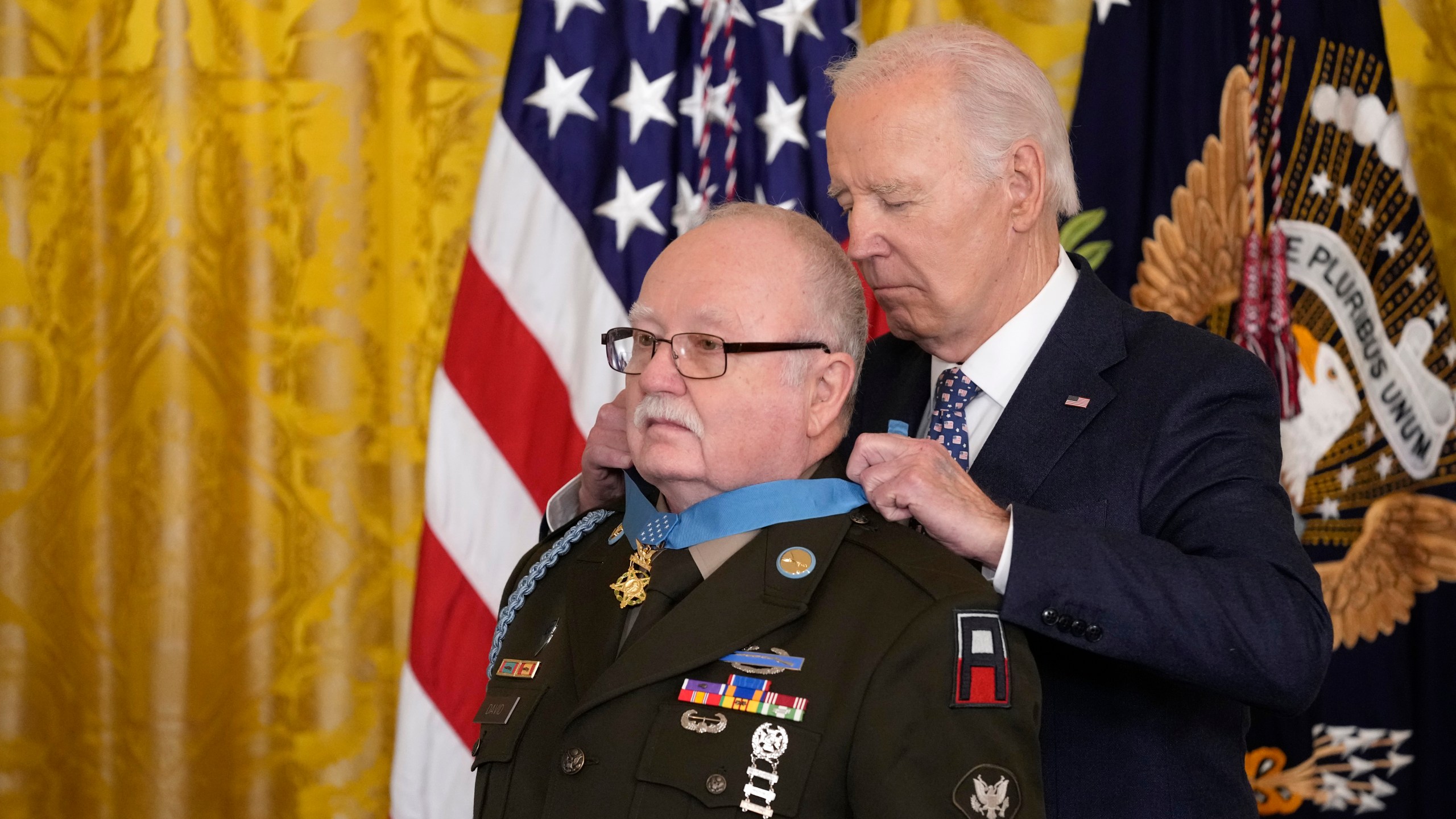 President Joe Biden presents the Medal of Honor, the nation's highest military decoration, to then-Private First Class Kenneth J. David, during a ceremony in the East Room of the White House in Washington, Friday, Jan. 3, 2025. (AP Photo/Susan Walsh)