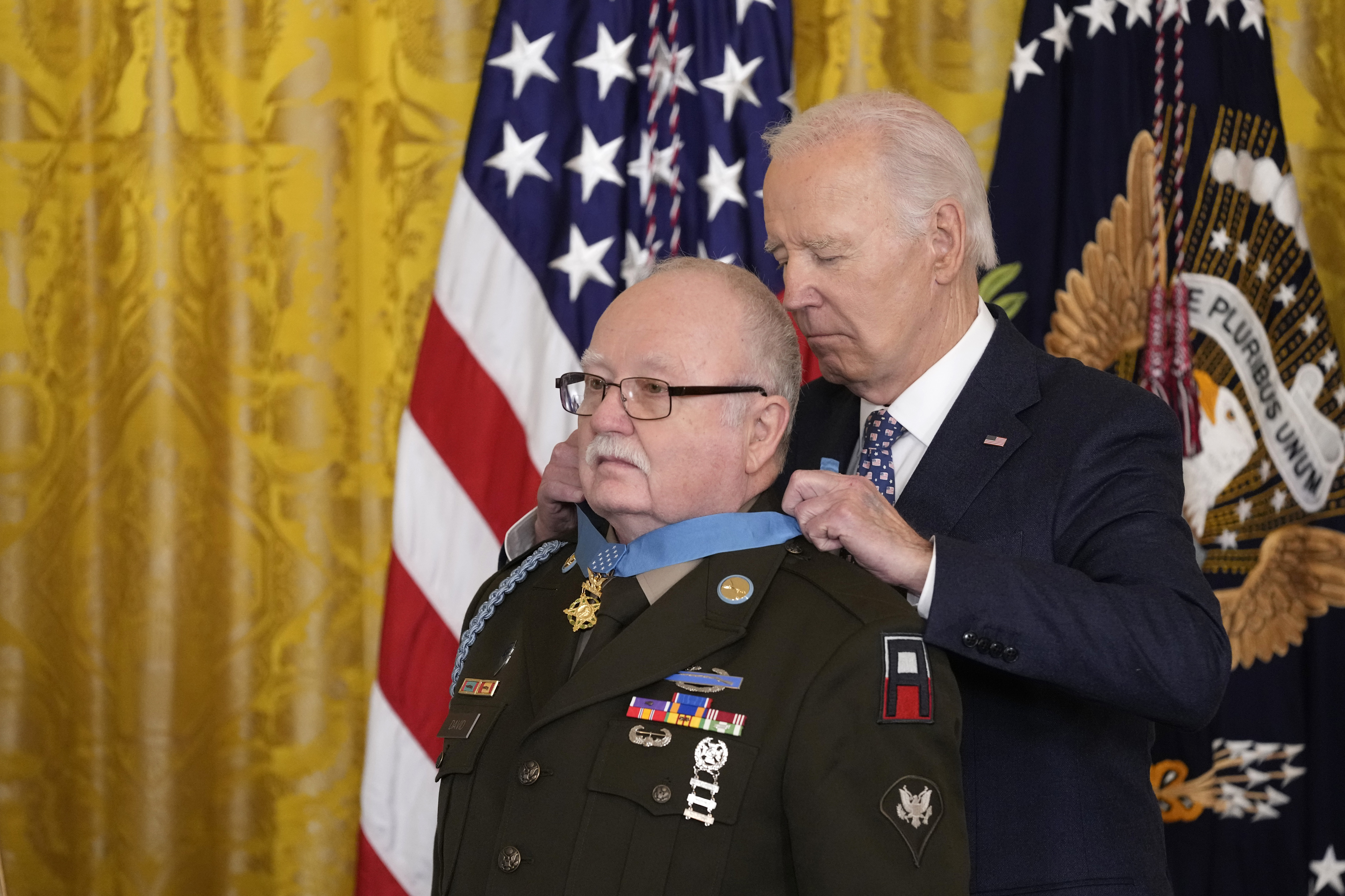 President Joe Biden presents the Medal of Honor, the nation's highest military decoration, to then-Private First Class Kenneth J. David, during a ceremony in the East Room of the White House in Washington, Friday, Jan. 3, 2025. (AP Photo/Susan Walsh)